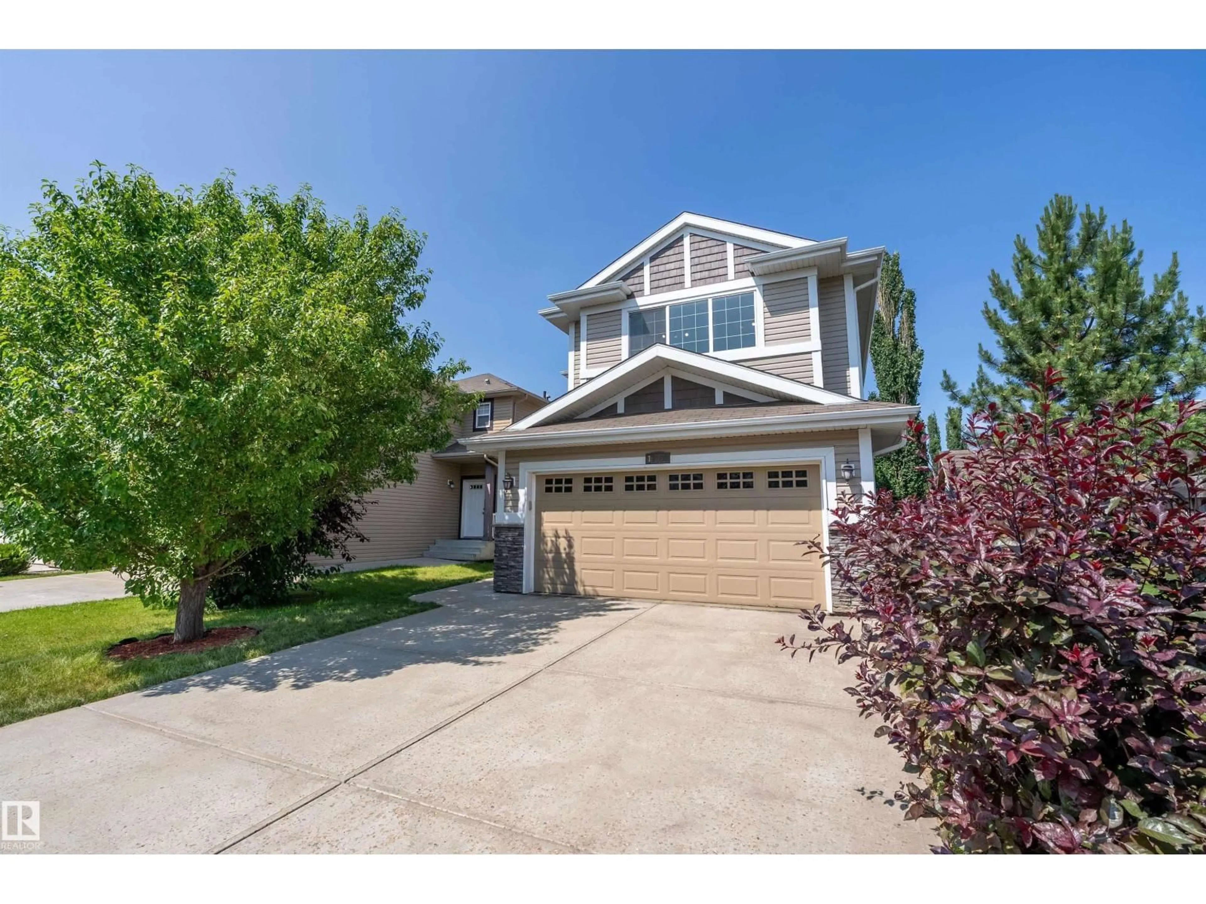 Home with vinyl exterior material, street for 17330 8A AV SW, Edmonton Alberta T6W0M8