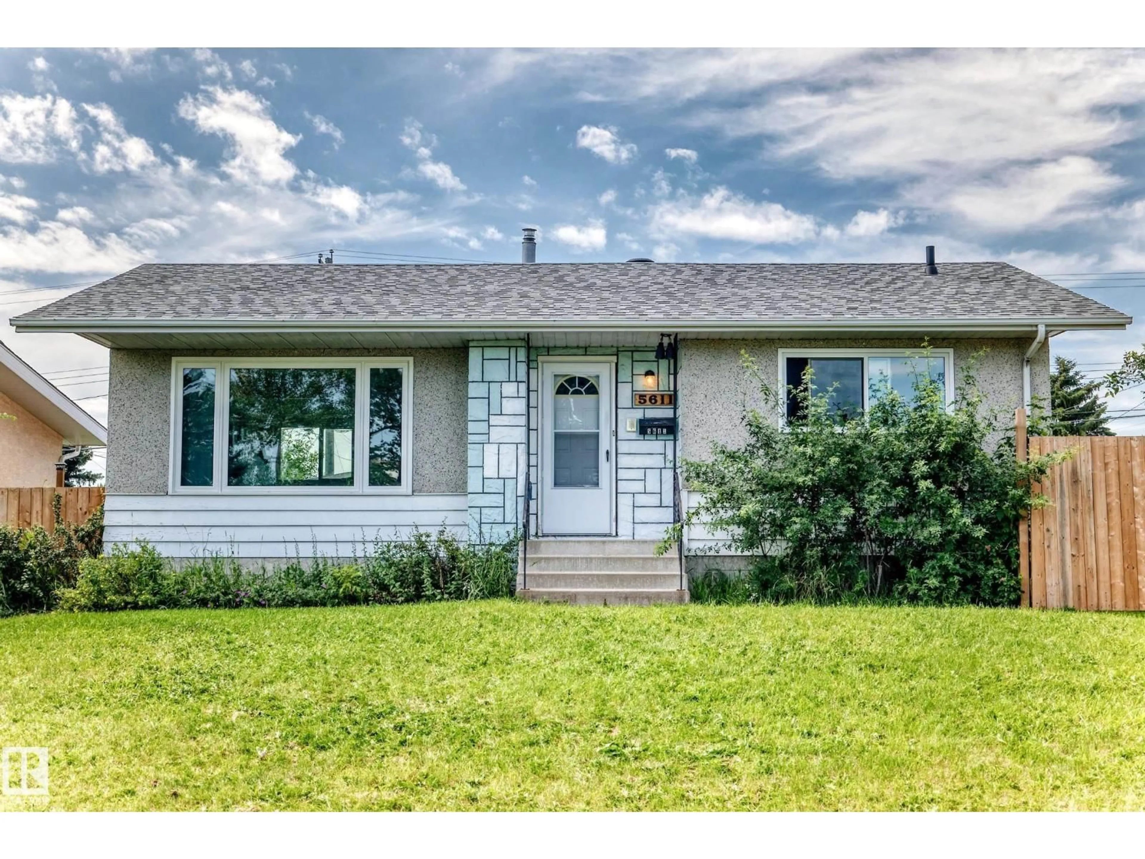 Home with vinyl exterior material, street for 5611 134A AV, Edmonton Alberta T5A0M3
