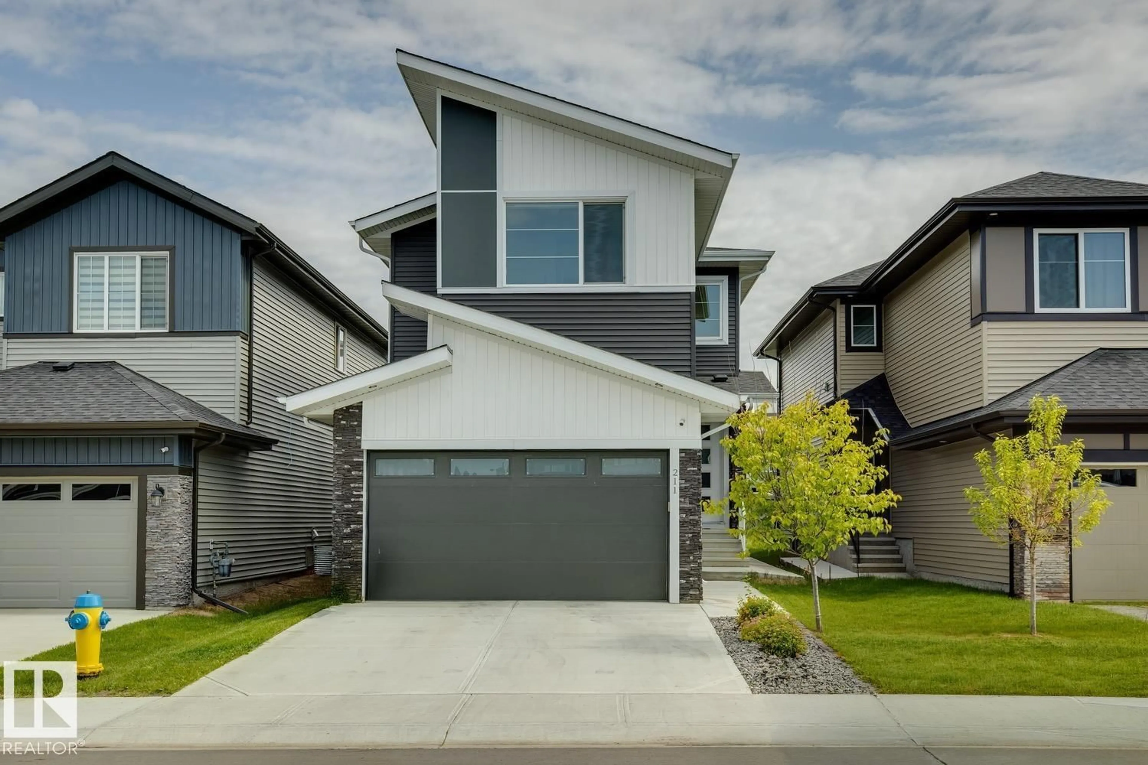 Home with vinyl exterior material, street for 211 KETTYL CO, Leduc Alberta T9E1S1