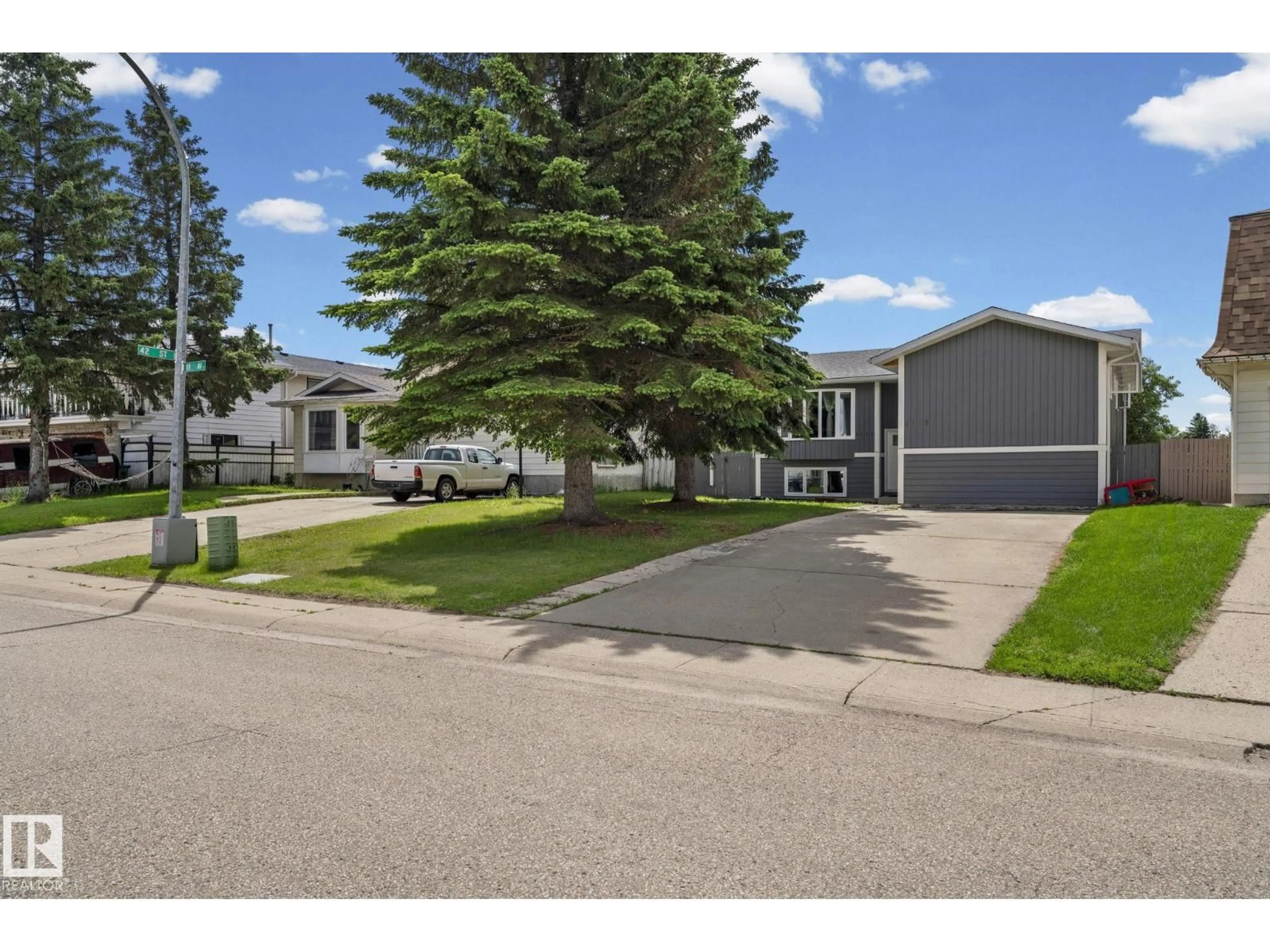 A pic from outside/outdoor area/front of a property/back of a property/a pic from drone, street for 4119 18 AV, Edmonton Alberta T6L3M3