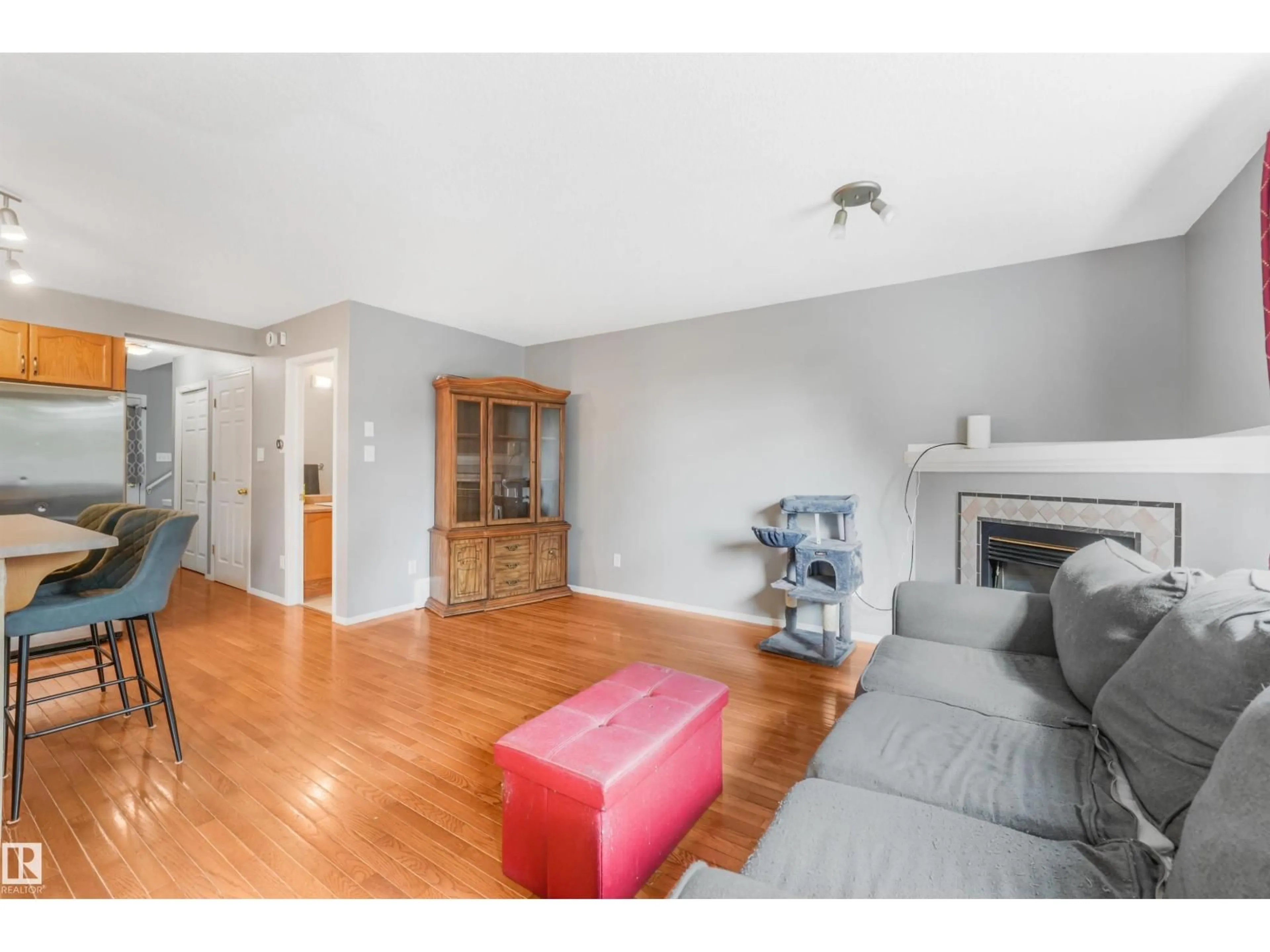 Living room with furniture, wood/laminate floor for 19 15215 126 ST NW, Edmonton Alberta T5X2Z3