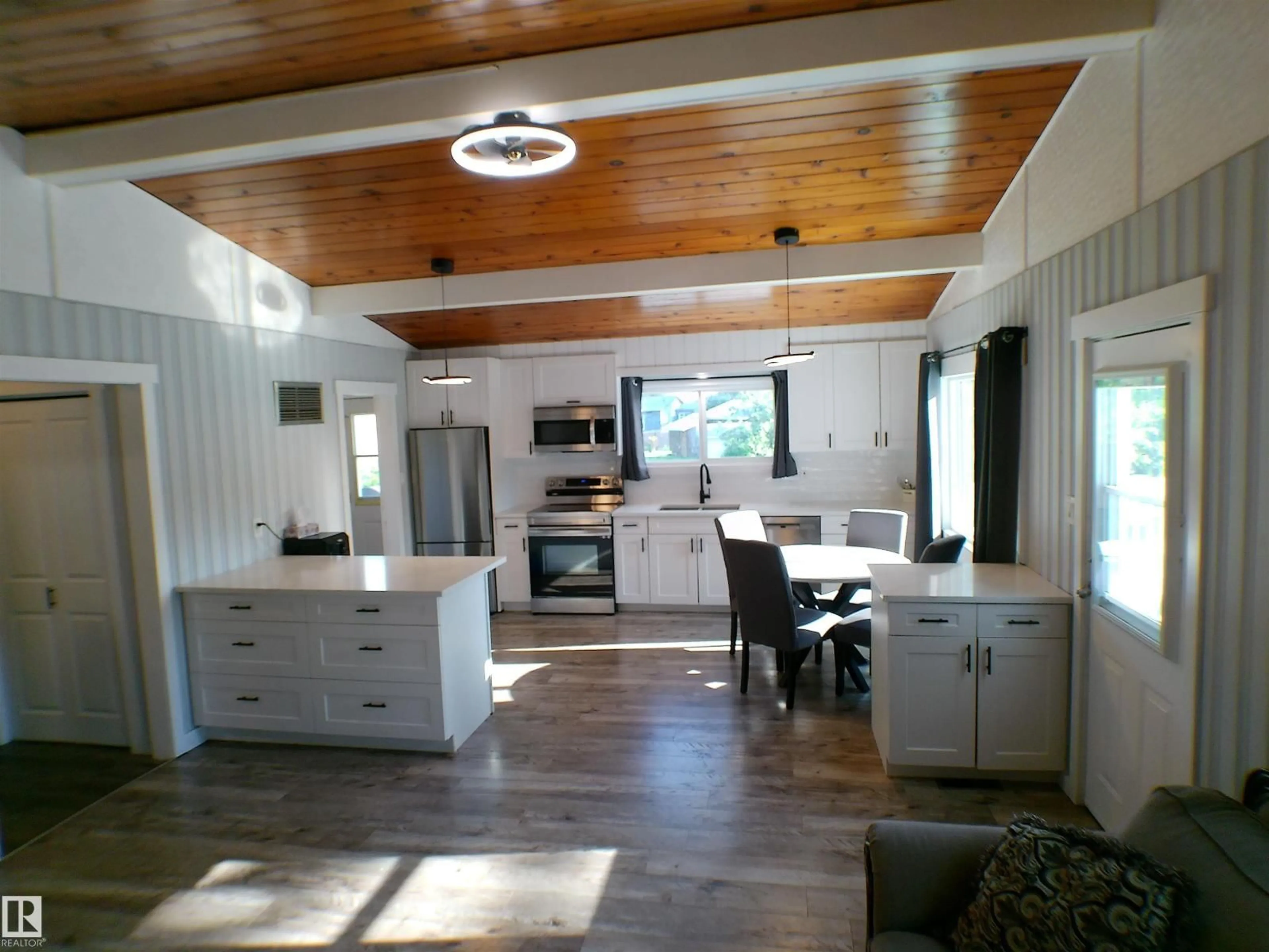 Open concept kitchen, wood/laminate floor for 708 7 ST, Rural Lac Ste. Anne County Alberta T0E1A0