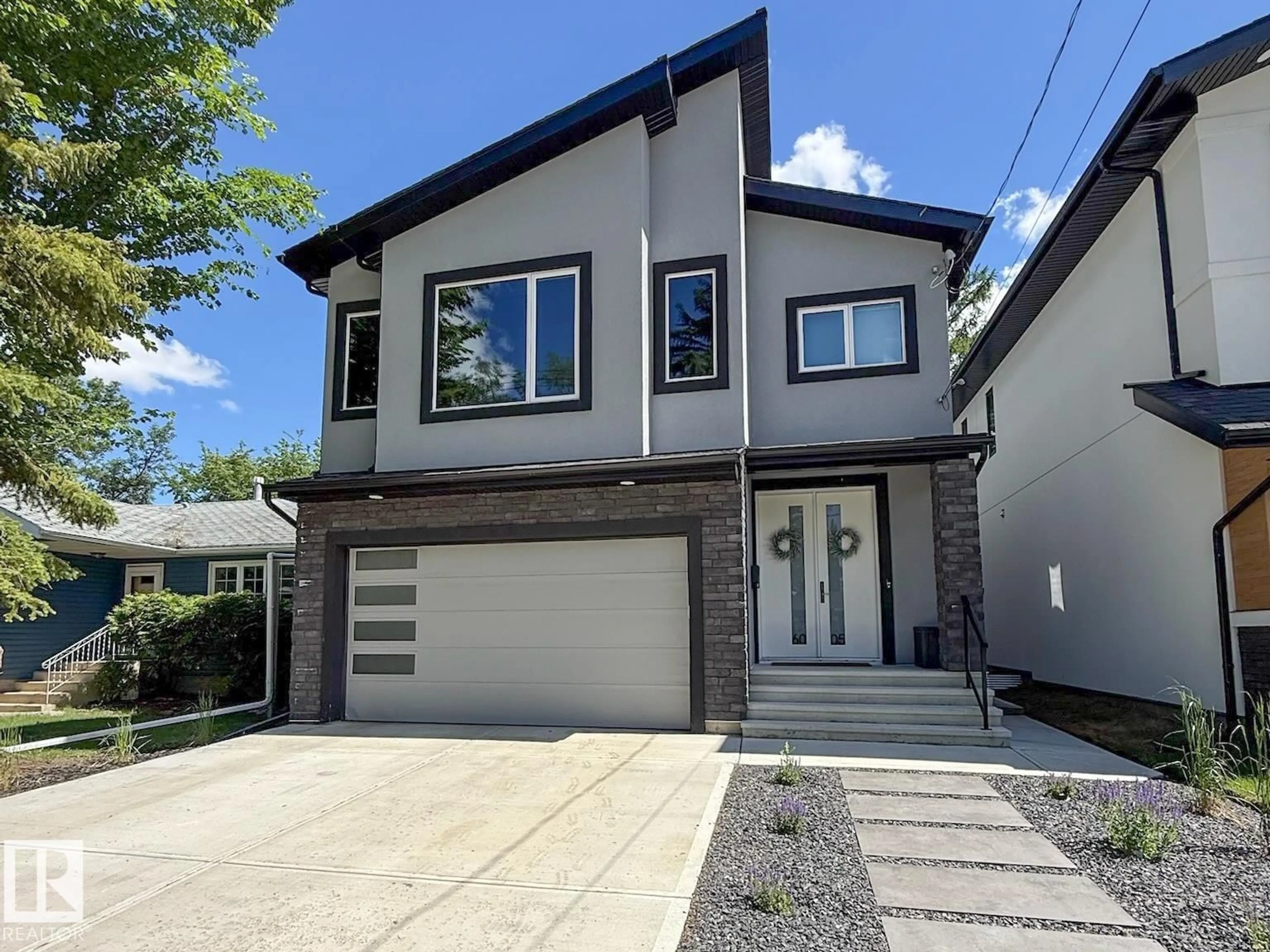 Home with vinyl exterior material, street for 6005 107 ST, Edmonton Alberta T6H2X9