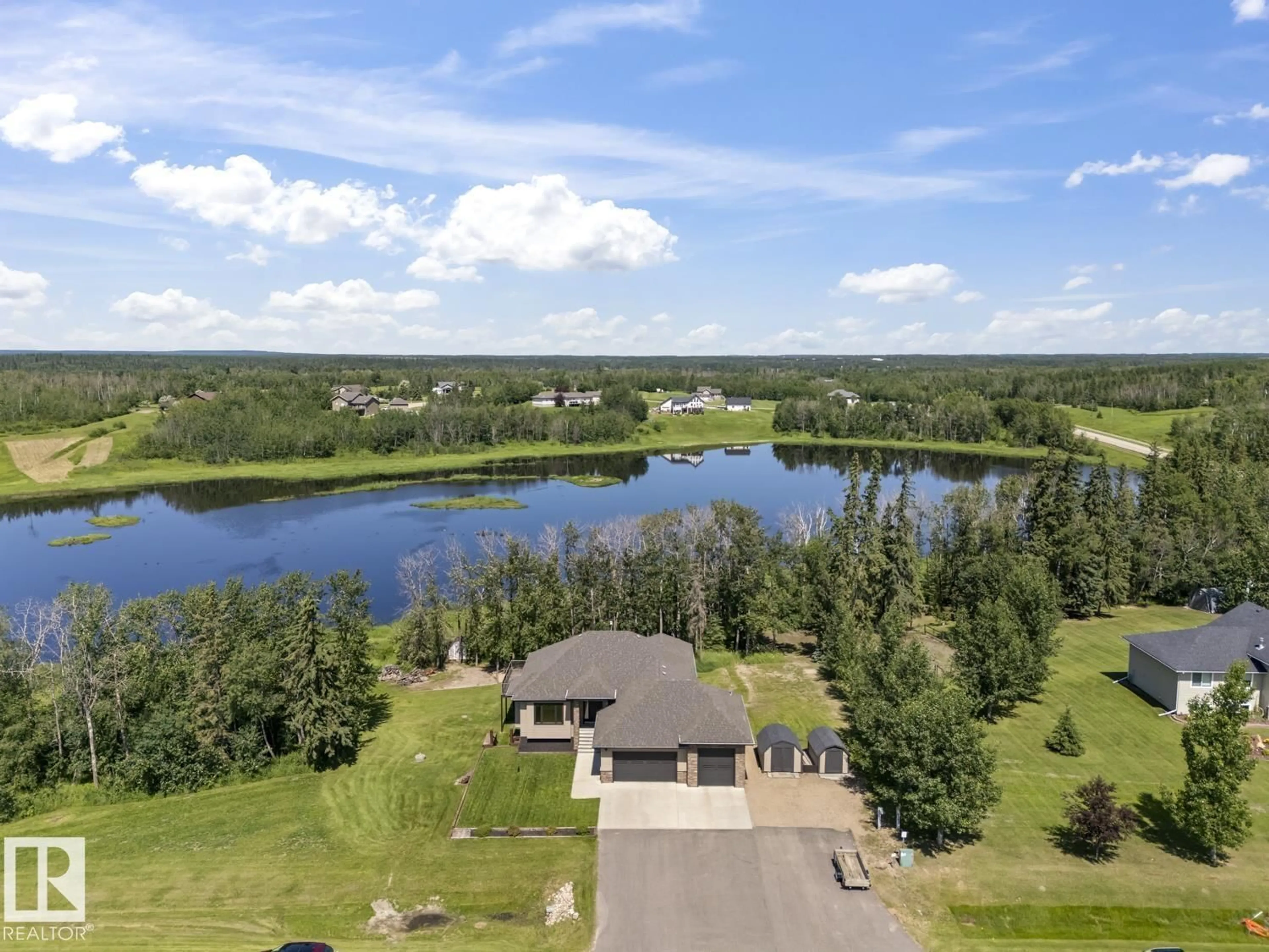 A pic from outside/outdoor area/front of a property/back of a property/a pic from drone, water/lake/river/ocean view for 6 - 61120 RR 465, Rural Bonnyville M.D. Alberta T9N2G9