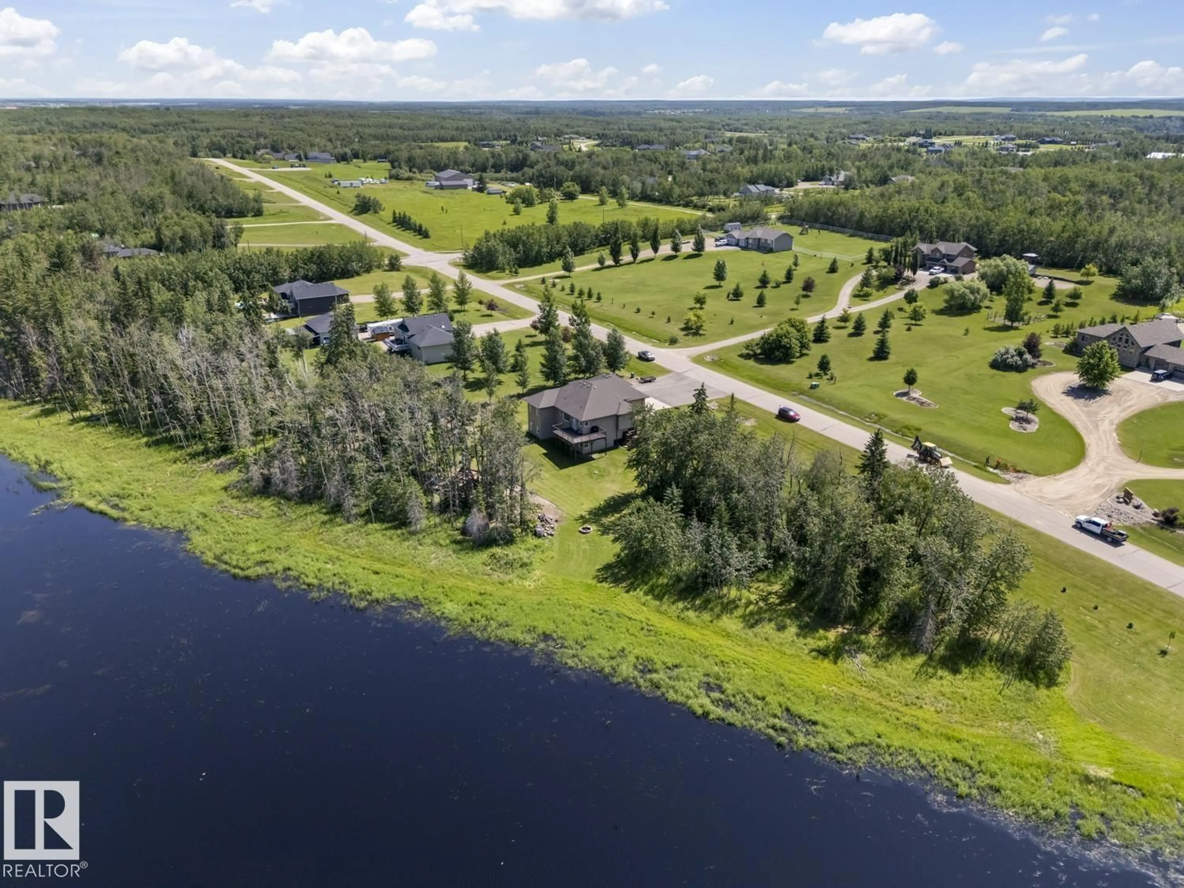 A pic from outside/outdoor area/front of a property/back of a property/a pic from drone, water/lake/river/ocean view for 6 - 61120 RR 465, Rural Bonnyville M.D. Alberta T9N2G9
