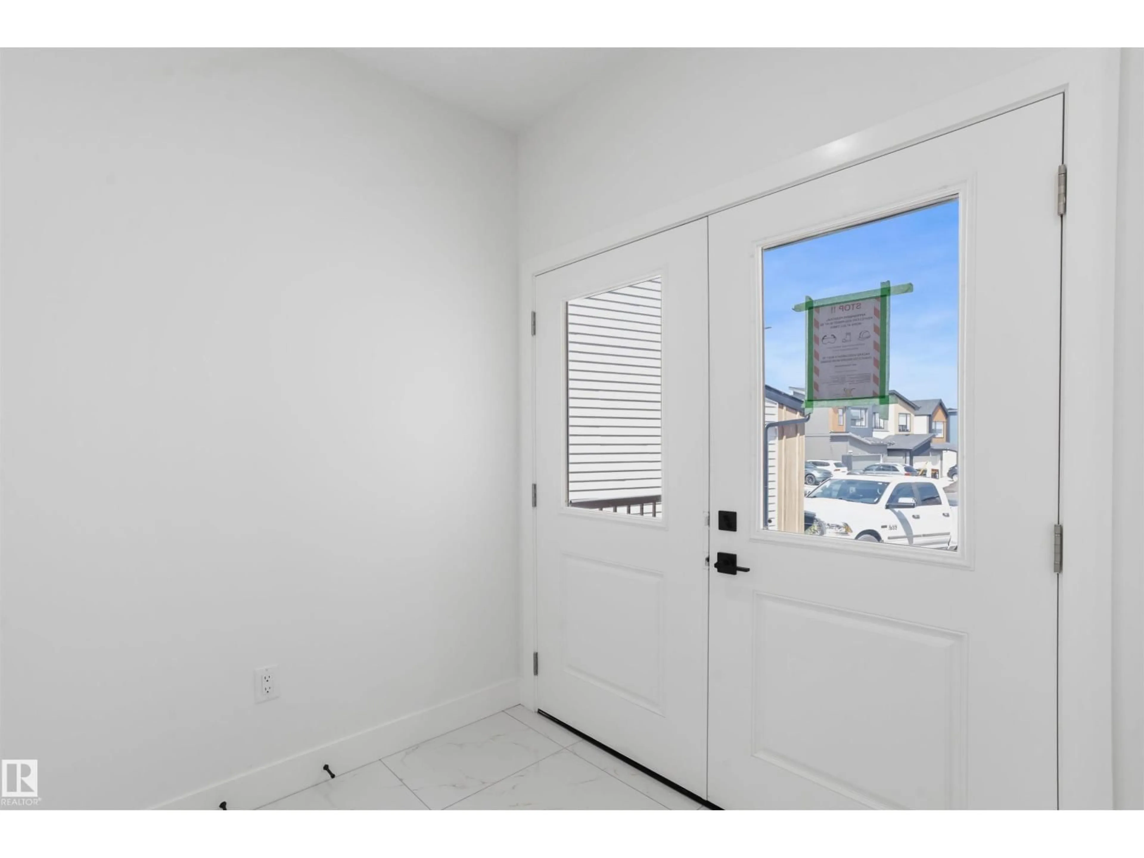 Indoor entryway for 3235 5 AV, Edmonton Alberta T6X3C9