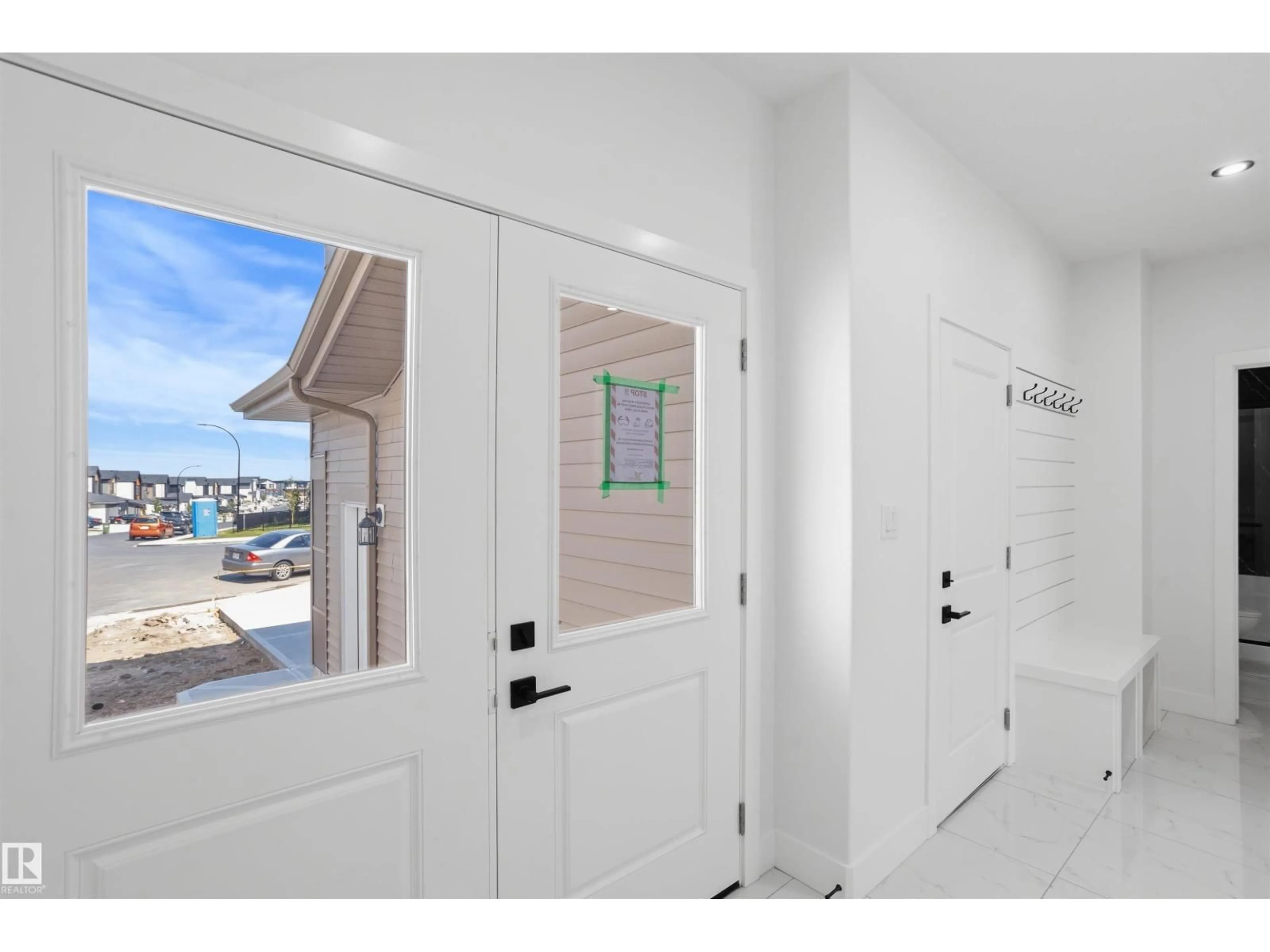 Indoor entryway for 3235 5 AV, Edmonton Alberta T6X3C9