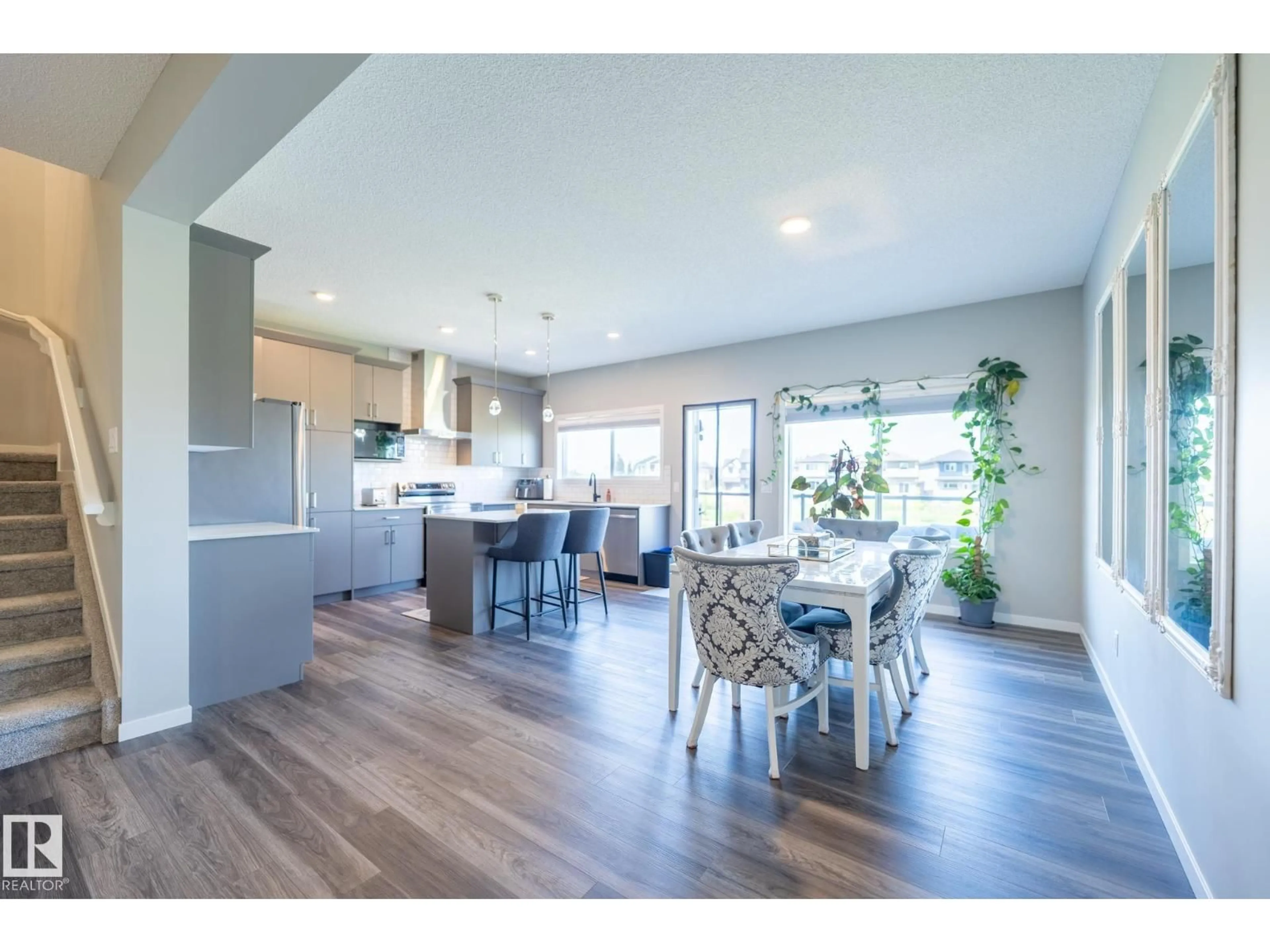 Open concept kitchen, wood/laminate floor for 5403 LARK LD, Edmonton Alberta T5S0S3