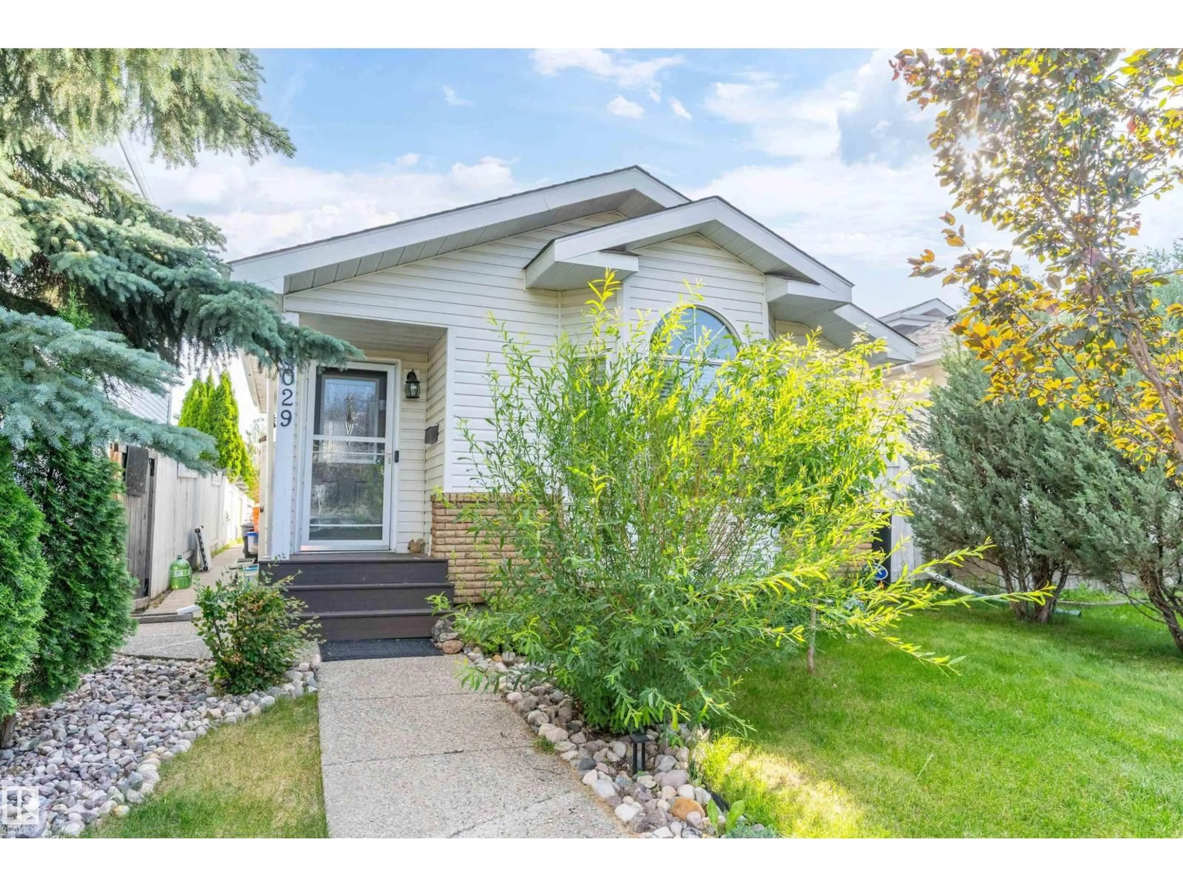 Home with vinyl exterior material, street for 8029 17A AV, Edmonton Alberta T6K4E1