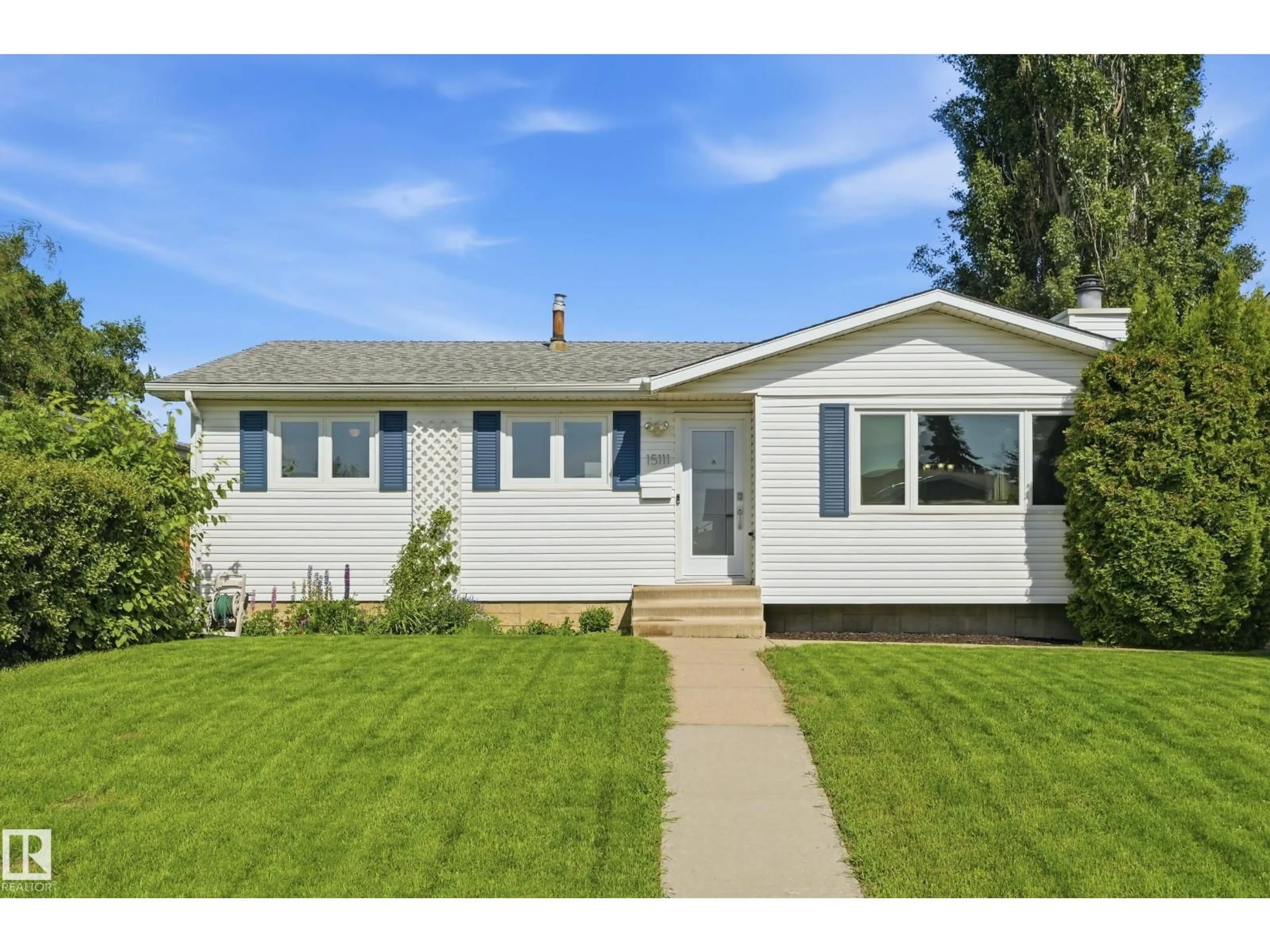 Home with vinyl exterior material, street for 15111 67 ST, Edmonton Alberta T5C0C9