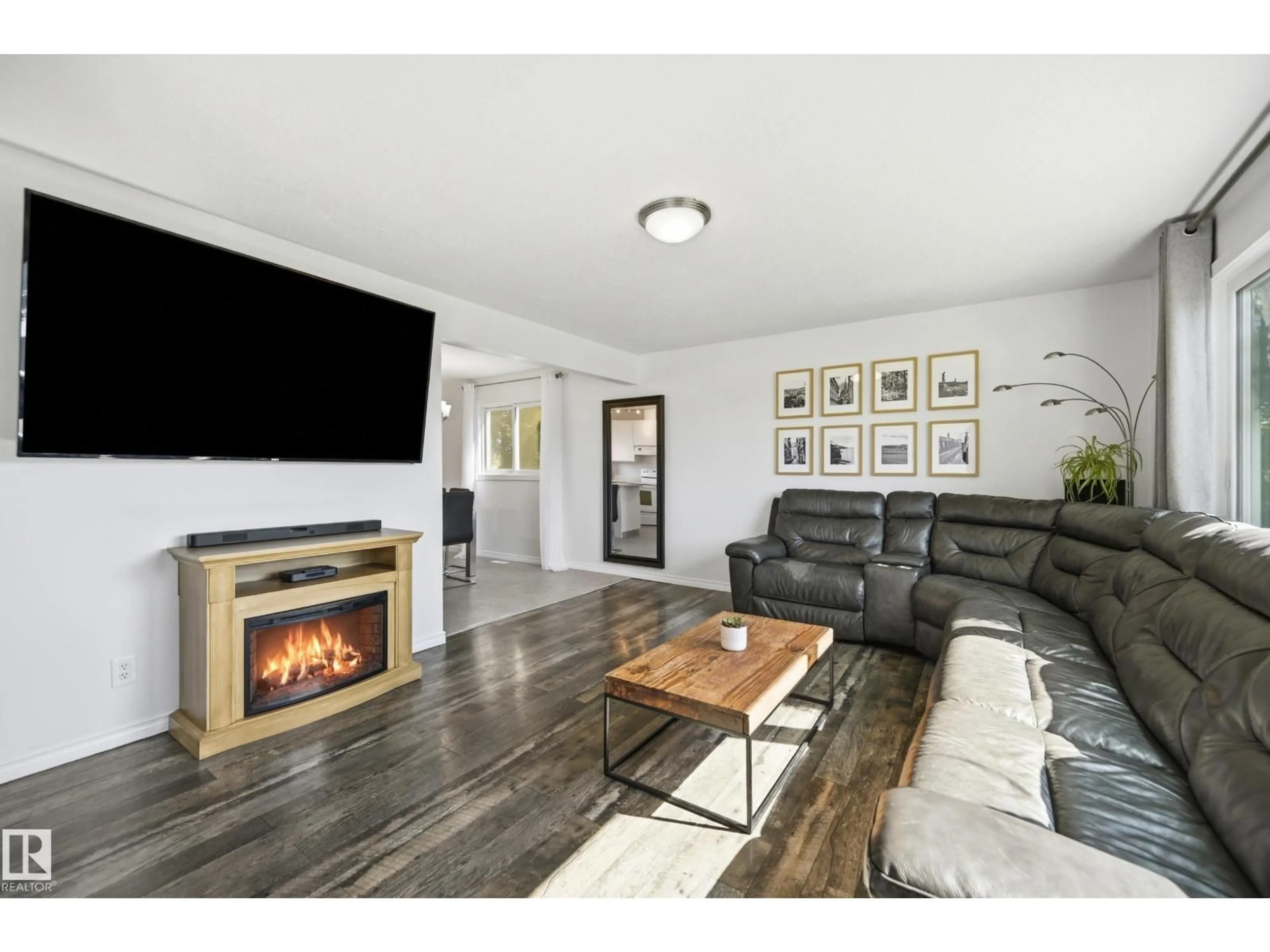 Living room with furniture, wood/laminate floor for 15111 67 ST, Edmonton Alberta T5C0C9