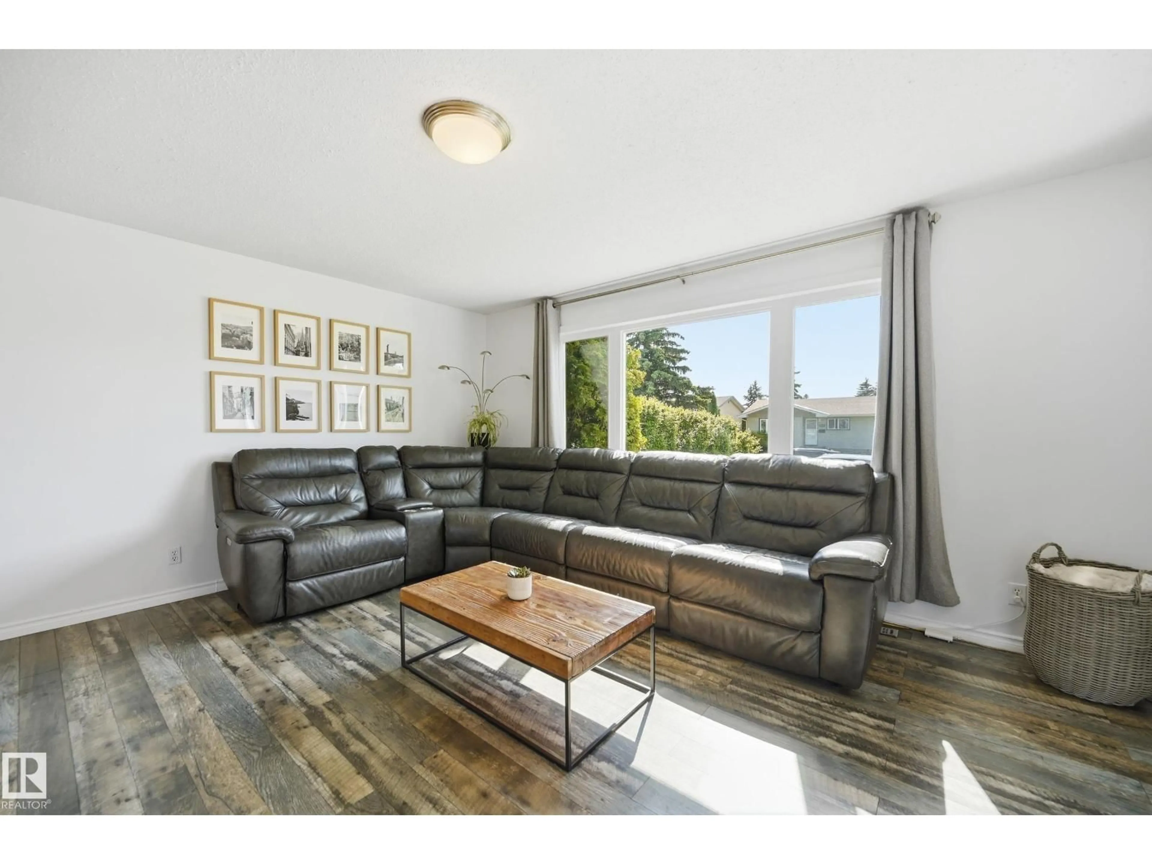 Living room with furniture, wood/laminate floor for 15111 67 ST, Edmonton Alberta T5C0C9