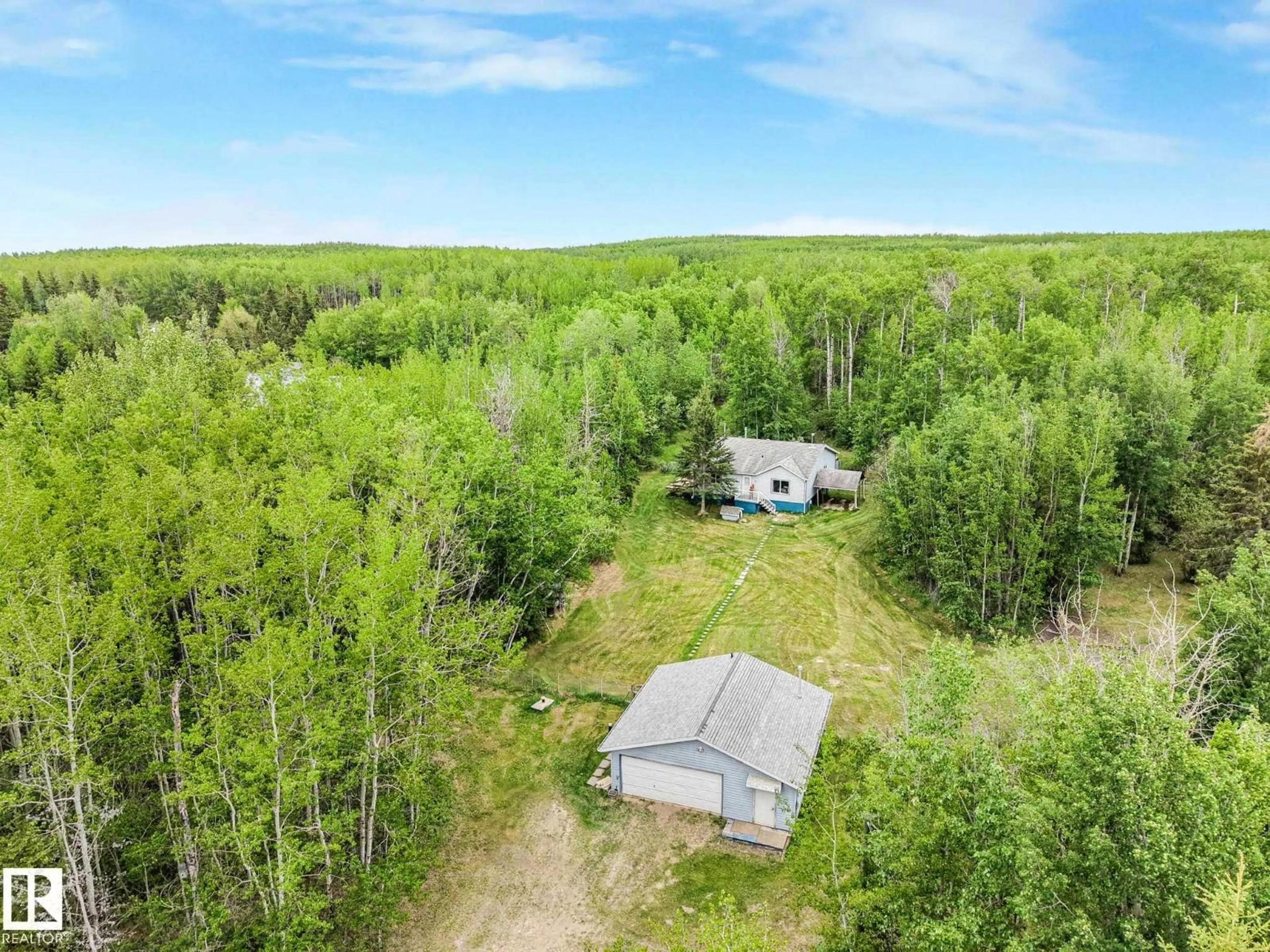 A pic from outside/outdoor area/front of a property/back of a property/a pic from drone, forest/trees view for 2120 TWP ROAD 565, Rural Lac Ste. Anne County Alberta T0E1V0