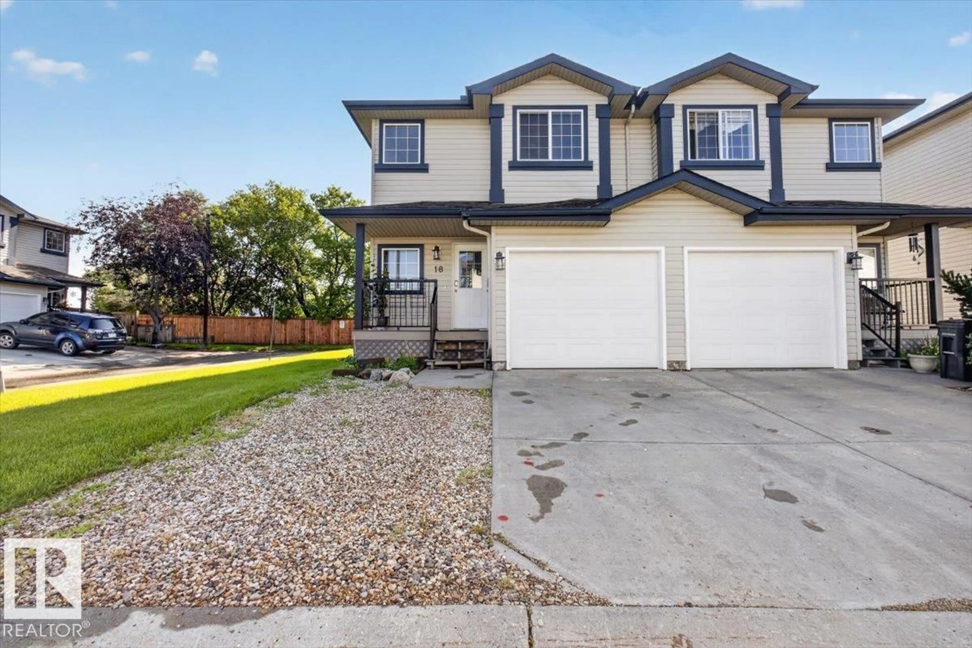 Home with vinyl exterior material, street for 345 - 18 KIRKNESS RD, Edmonton Alberta T5Y2M7