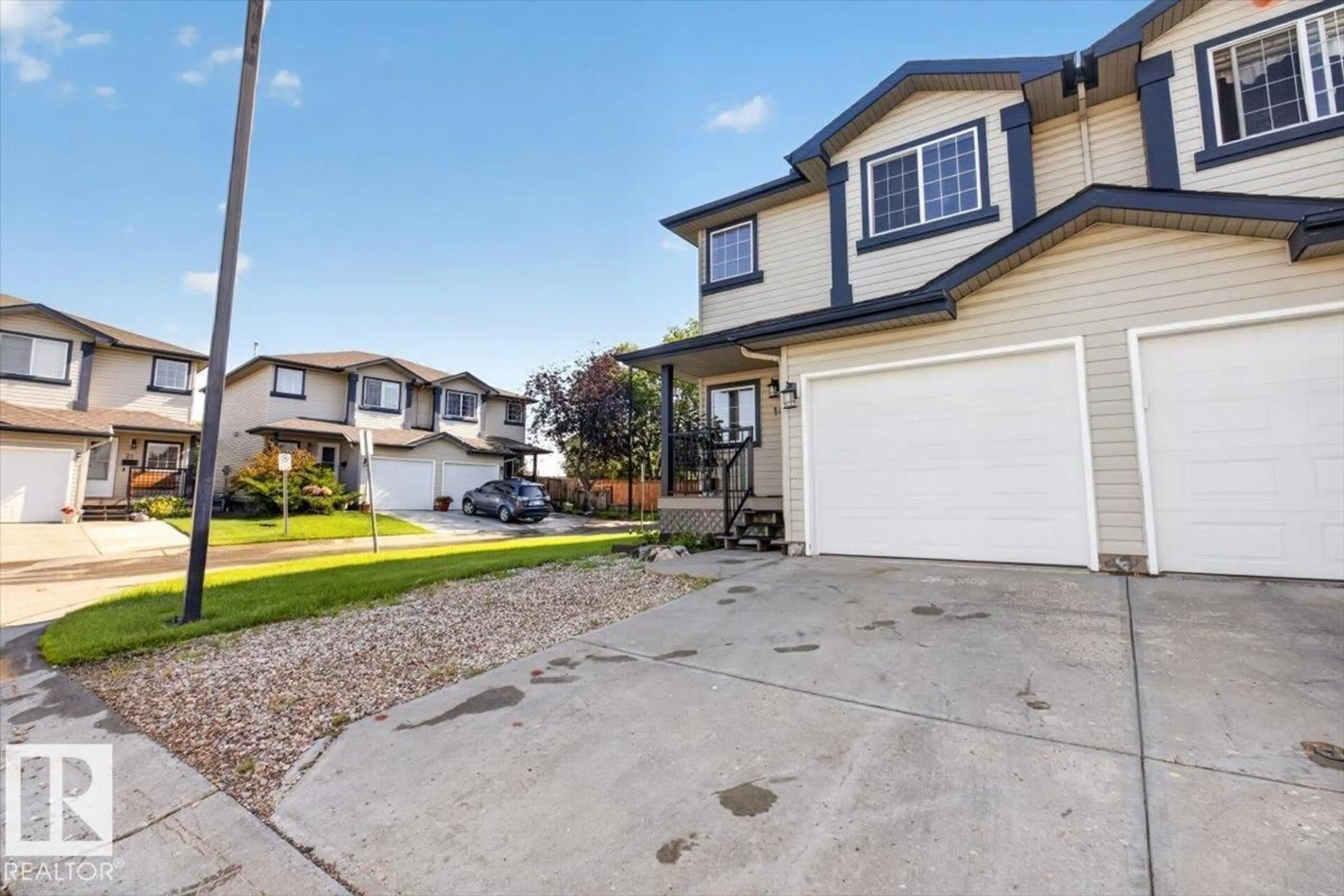 Home with vinyl exterior material, street for 345 - 18 KIRKNESS RD, Edmonton Alberta T5Y2M7