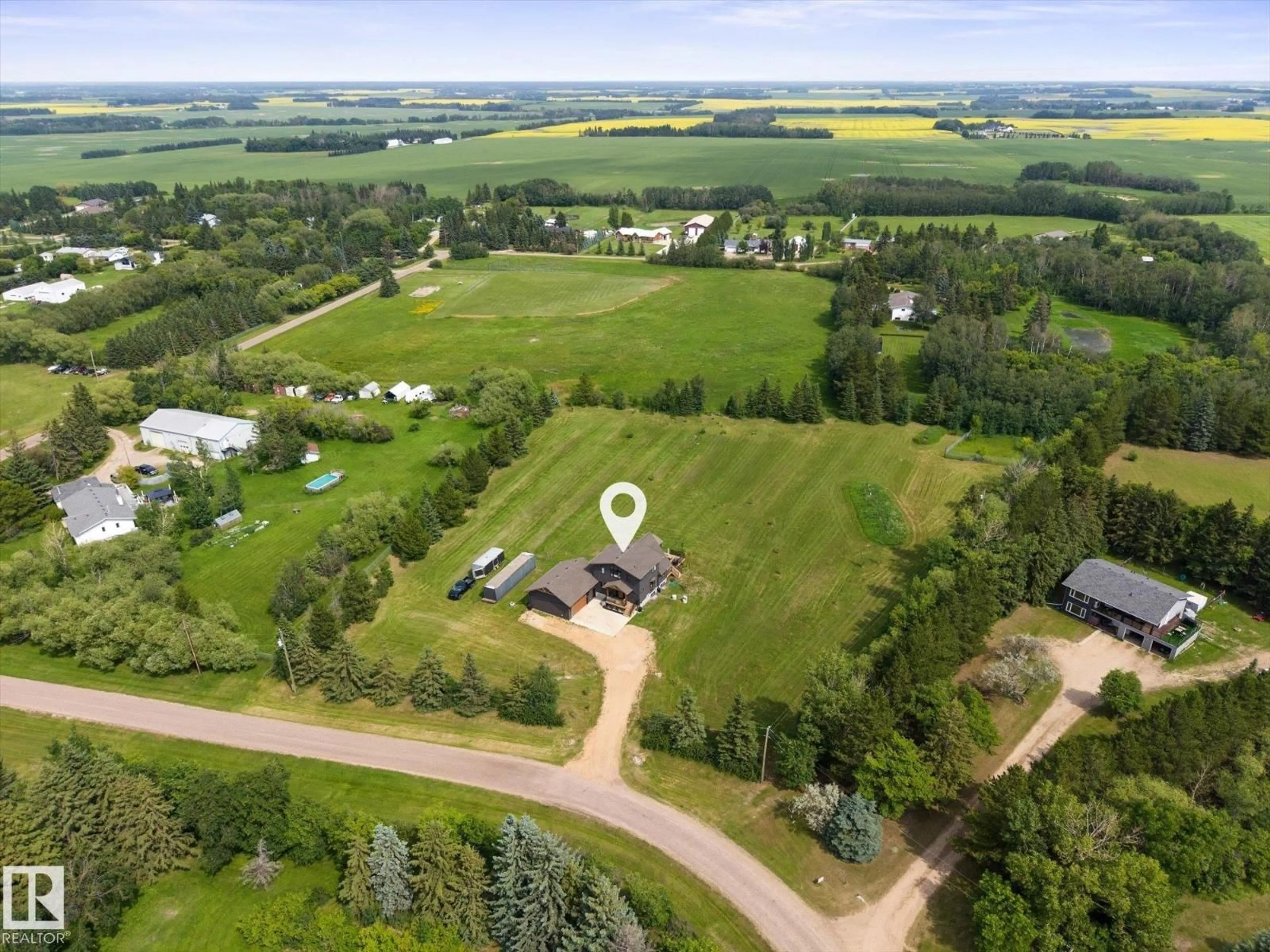 A pic from outside/outdoor area/front of a property/back of a property/a pic from drone, unknown for 90 - 50047 RGE RD 244, Rural Leduc County Alberta T4X0N8