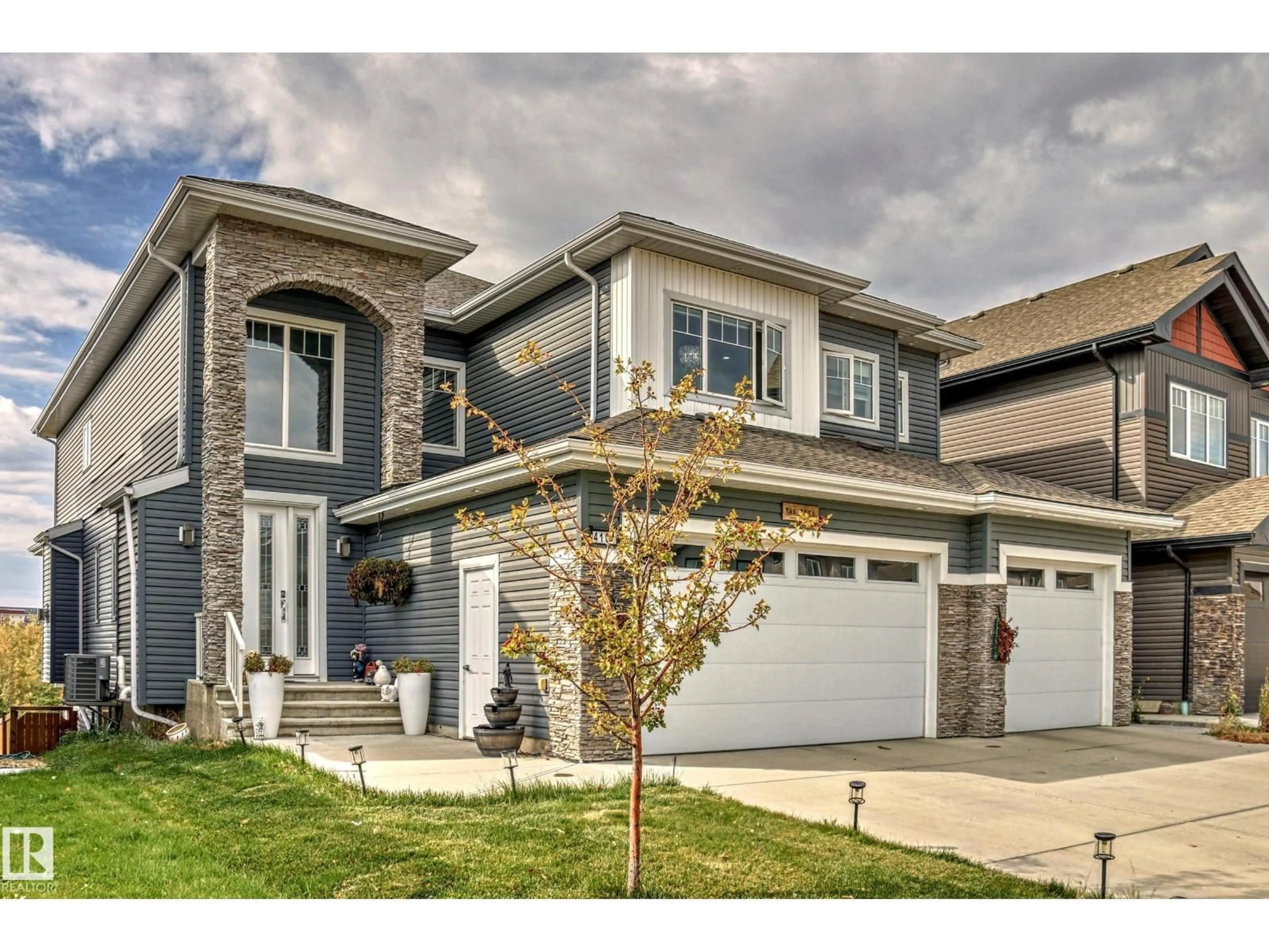 Home with vinyl exterior material, street for 4104 8 ST, Edmonton Alberta T6T0T3