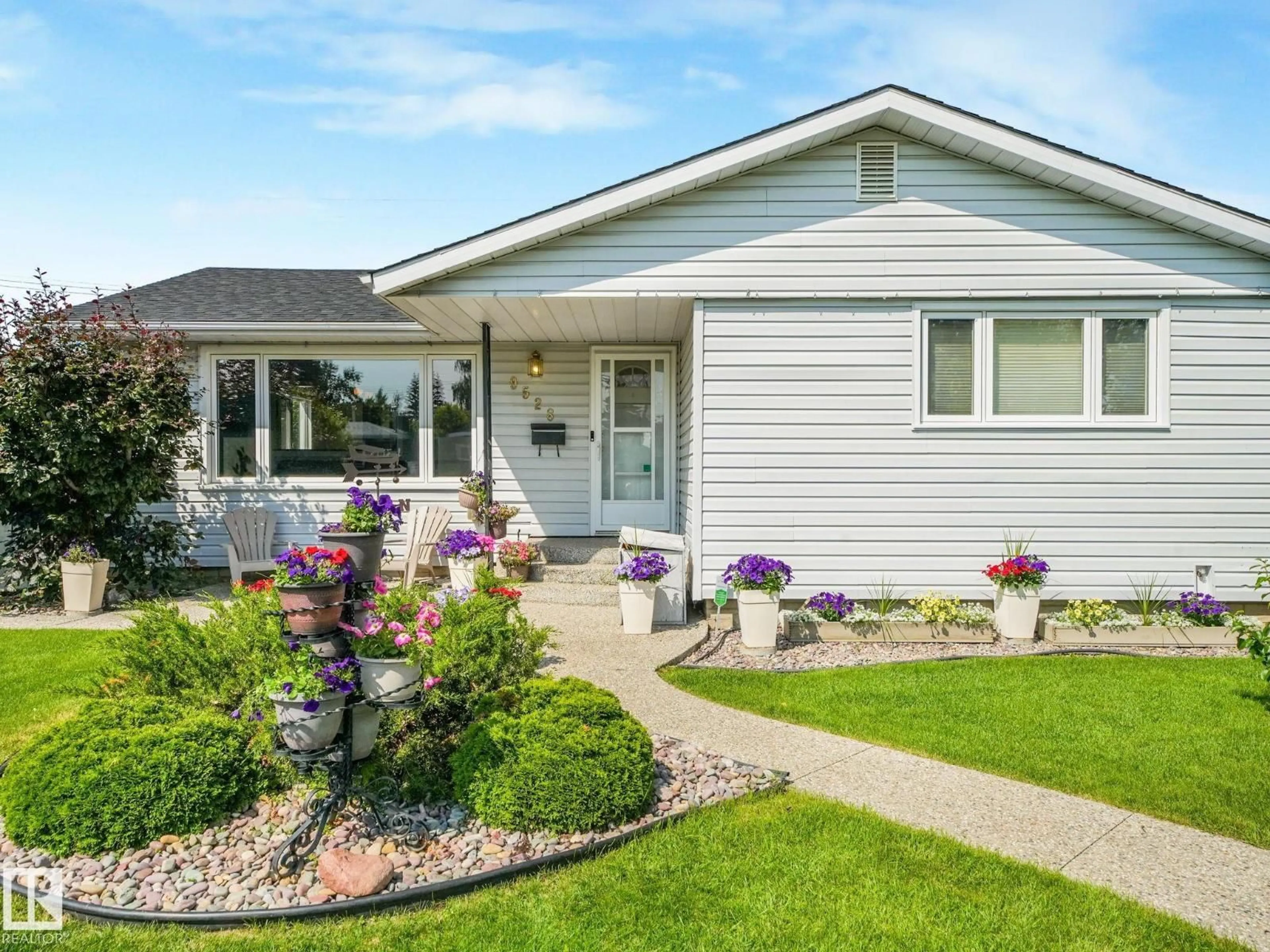 Home with vinyl exterior material, street for NW - 9528 54 ST, Edmonton Alberta T6B1H5