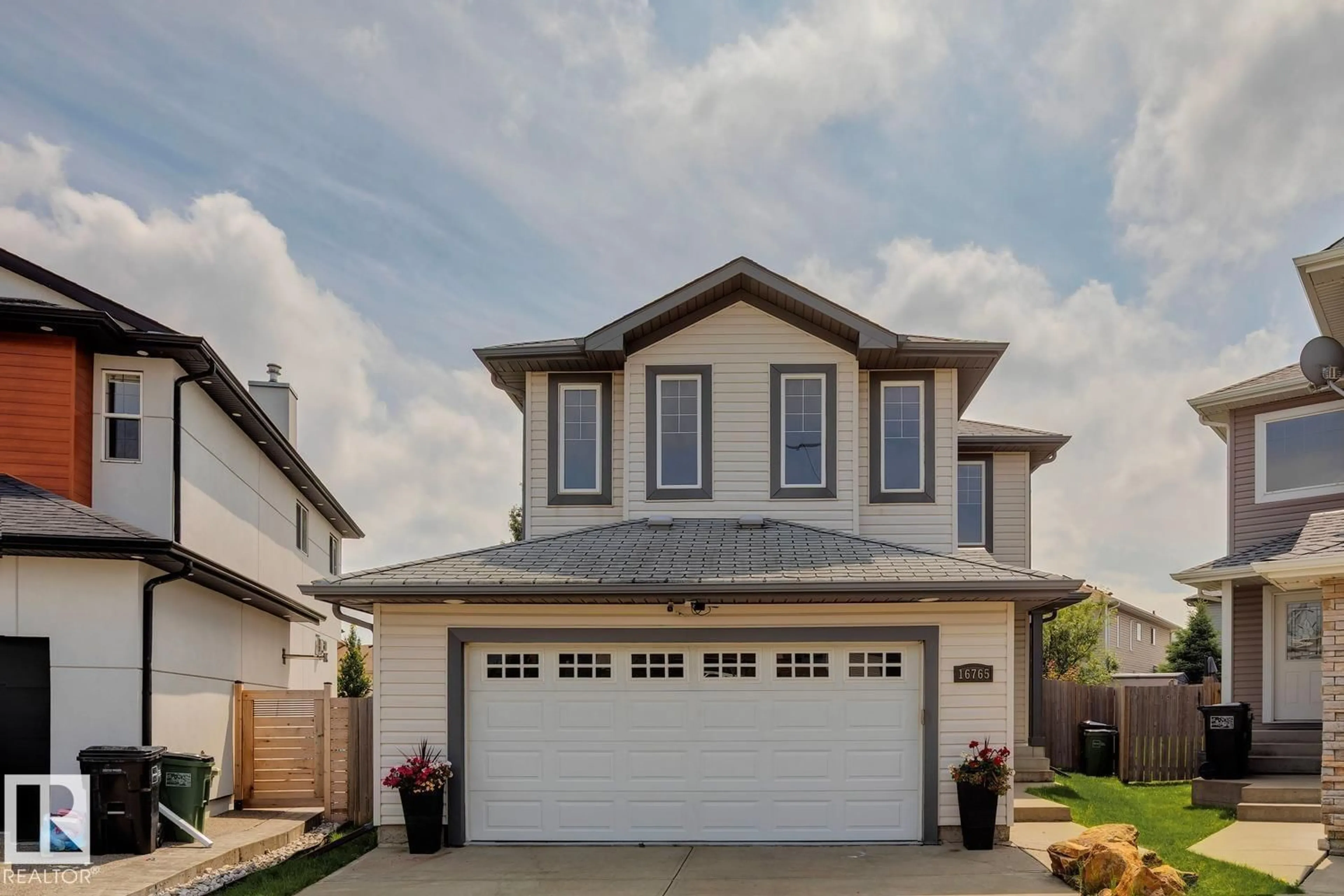 Home with vinyl exterior material, street for NW - 16765 119 ST, Edmonton Alberta T5X6K4