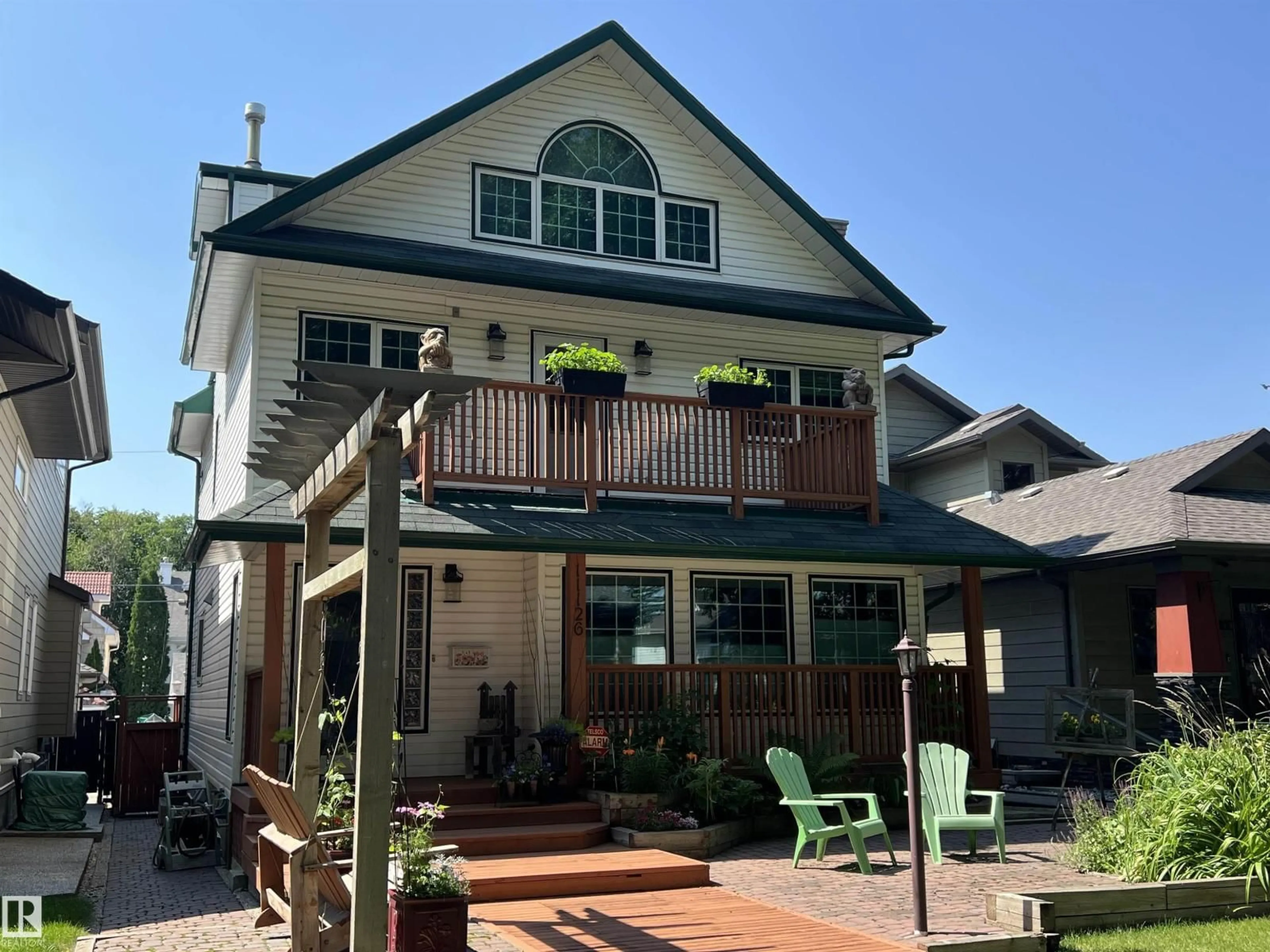 Home with vinyl exterior material, street for NW - 11126 52 ST, Edmonton Alberta T5W3H7
