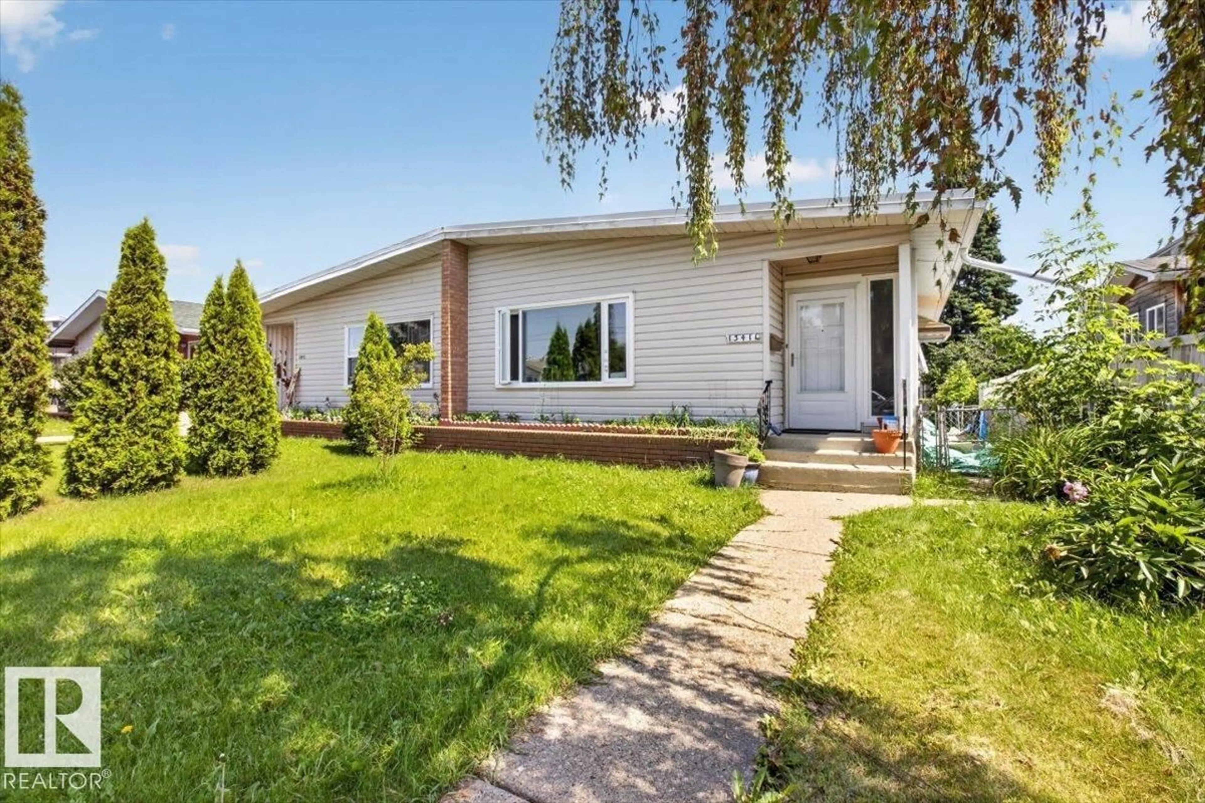 Home with vinyl exterior material, street for 13411 101 ST, Edmonton Alberta T5E4G5