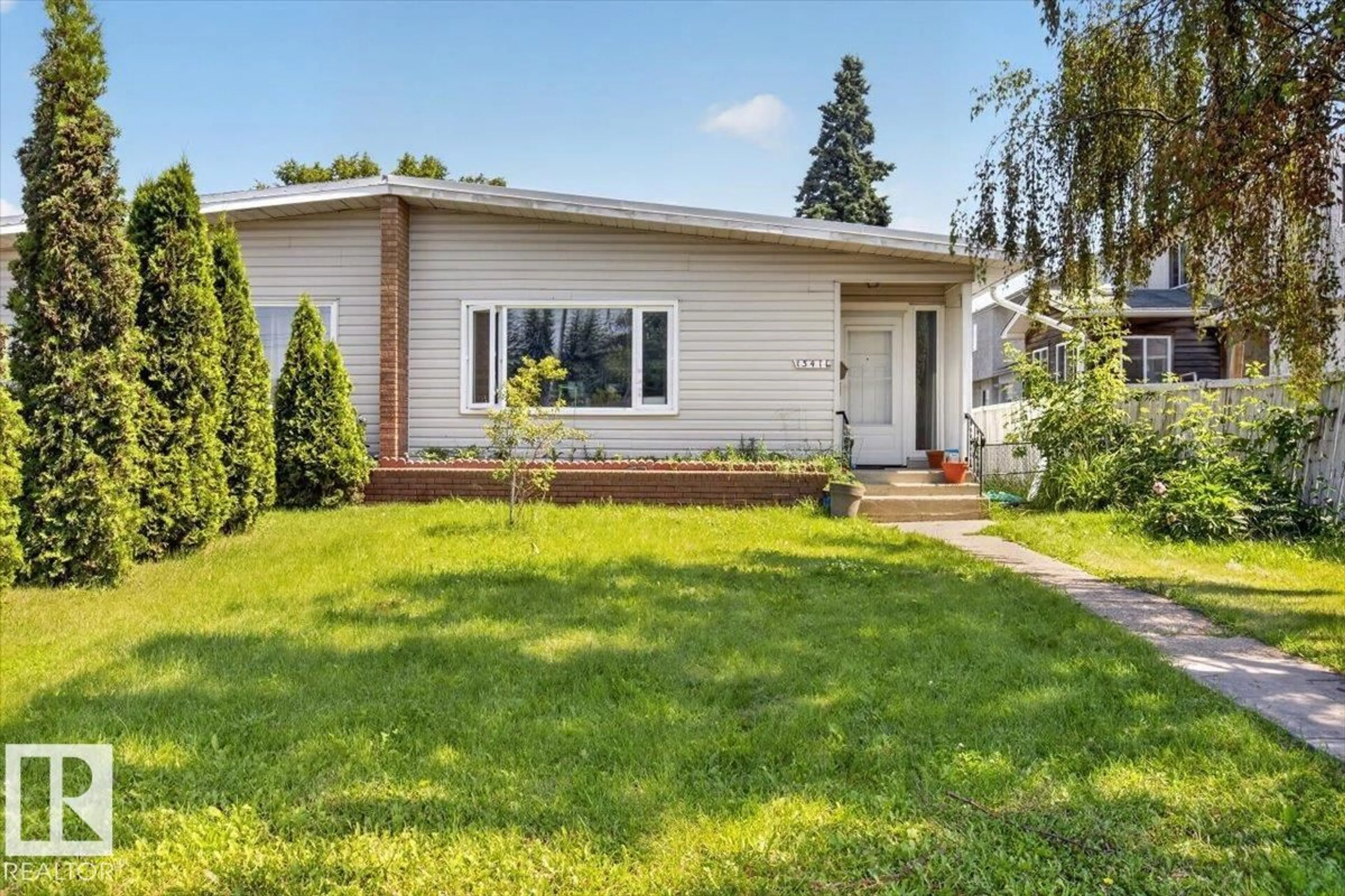 Home with vinyl exterior material, street for 13411 101 ST, Edmonton Alberta T5E4G5