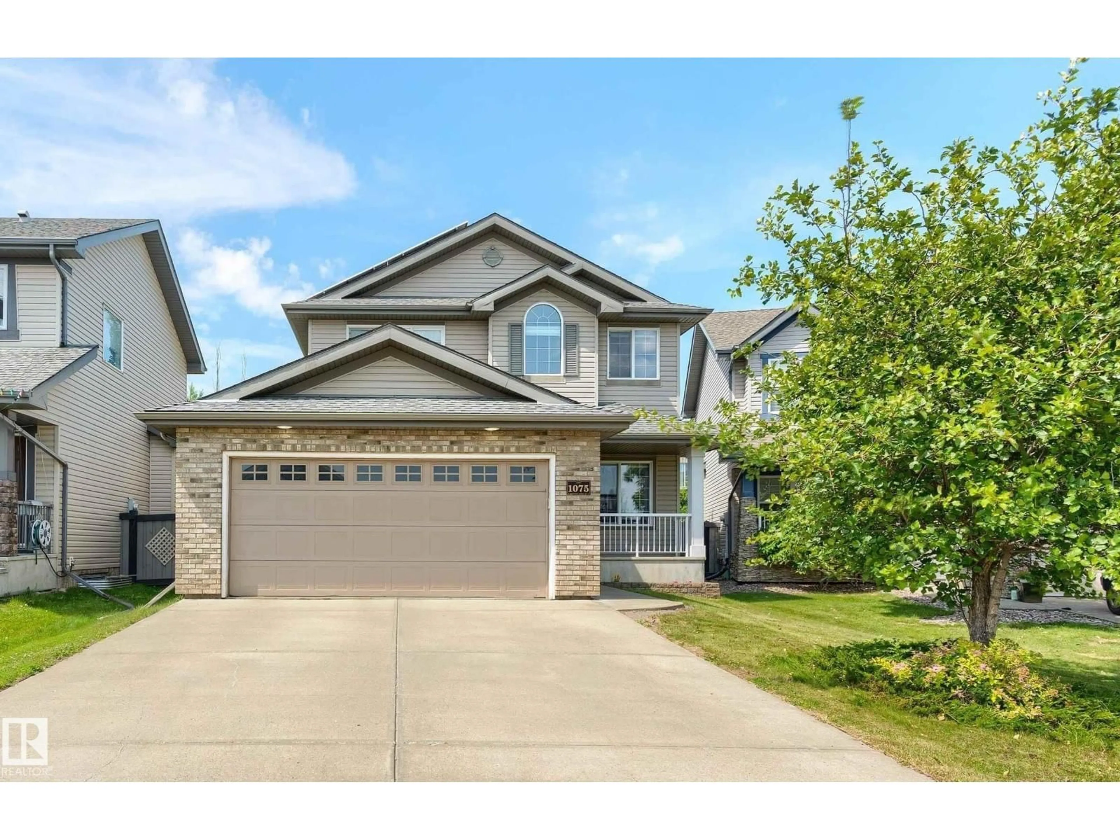 Home with vinyl exterior material, street for NW - 1075 MCKINNEY GREEN GR, Edmonton Alberta T6R3S5