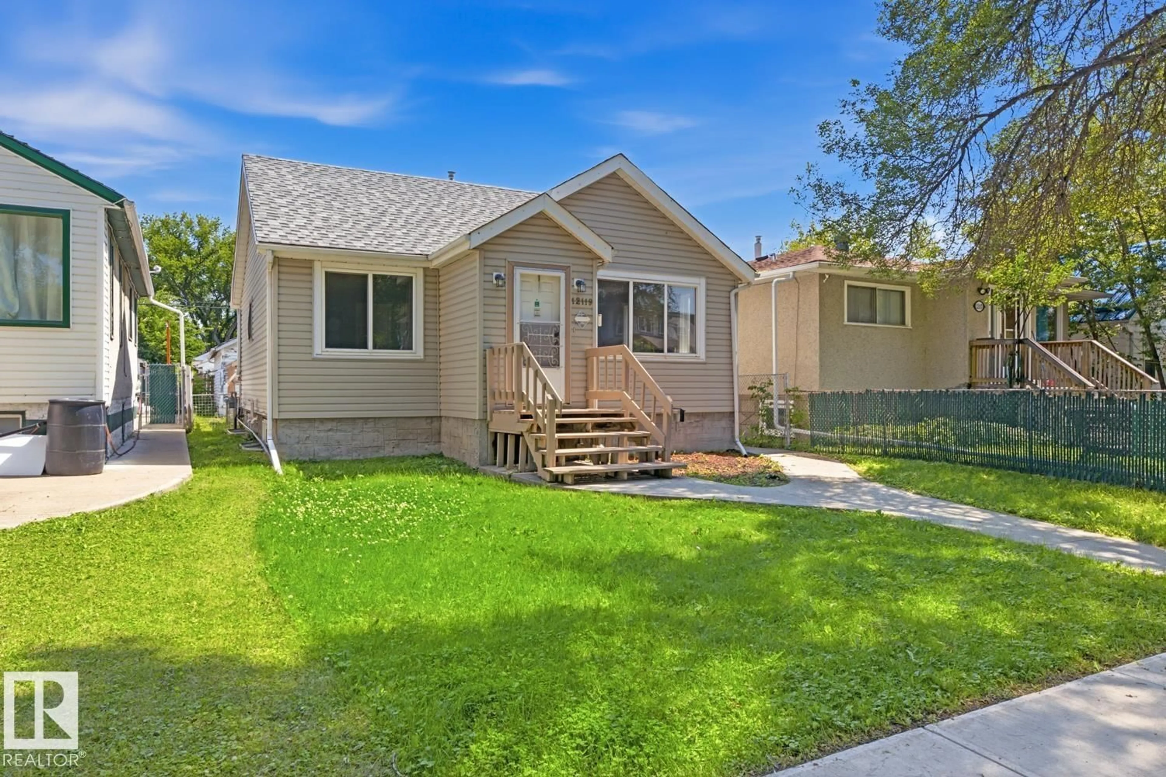 Home with vinyl exterior material, street for 12119 95A ST, Edmonton Alberta T5G1R8