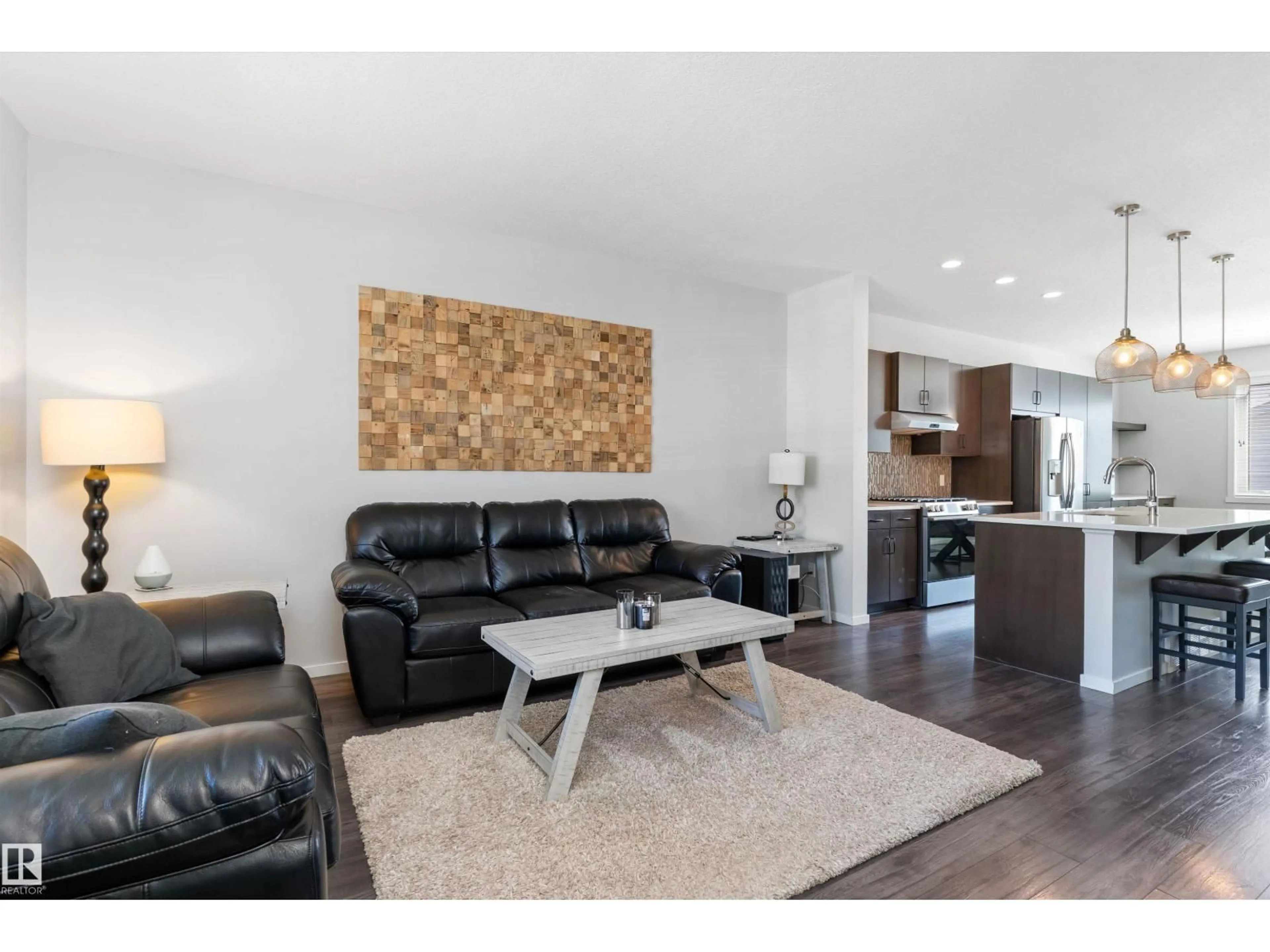 Living room with furniture, wood/laminate floor for 3456 CUTLER CR, Edmonton Alberta T6W2B3