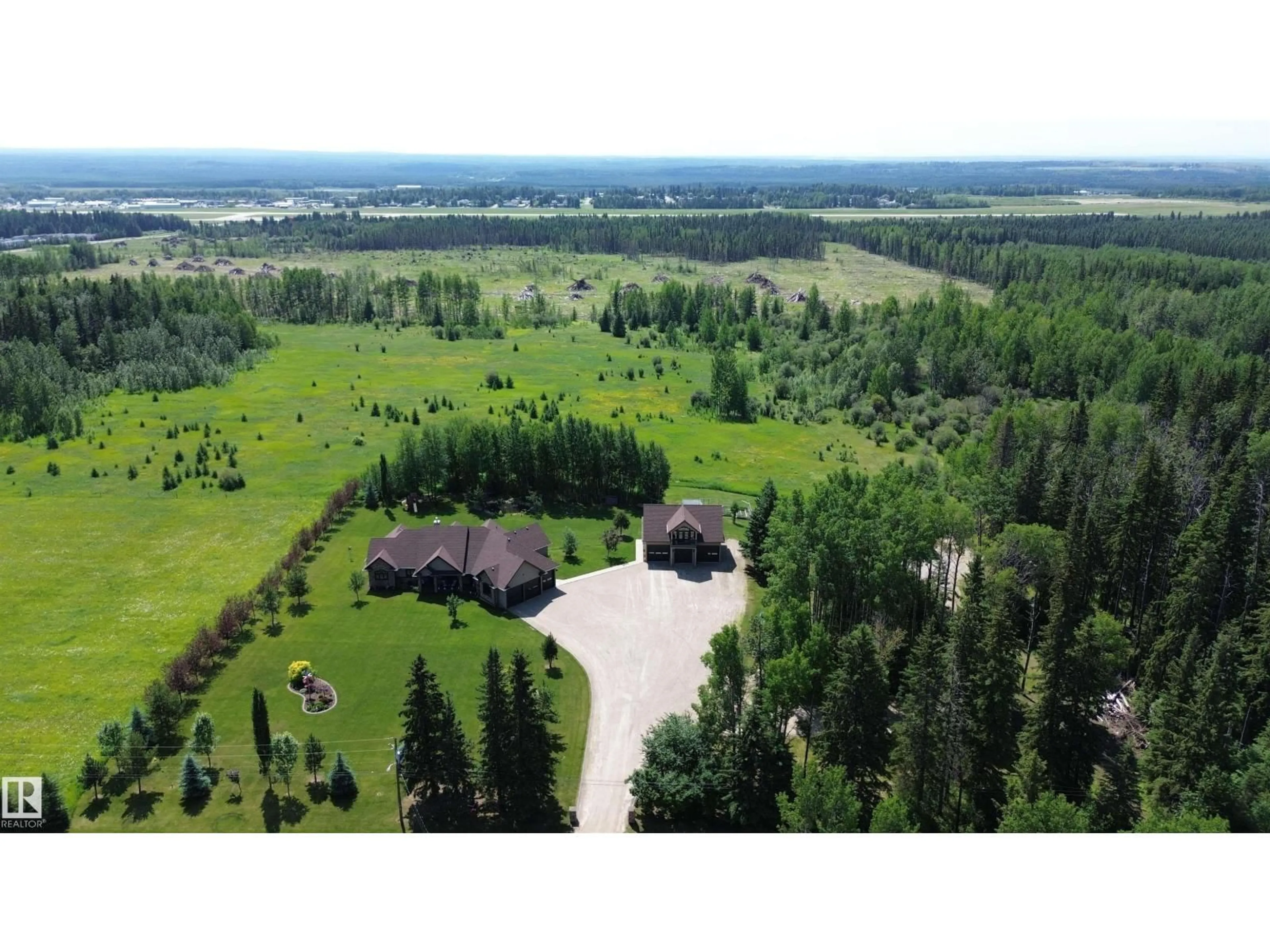 A pic from outside/outdoor area/front of a property/back of a property/a pic from drone, forest/trees view for 6663 15 AVE, Edson Alberta T7E1S3
