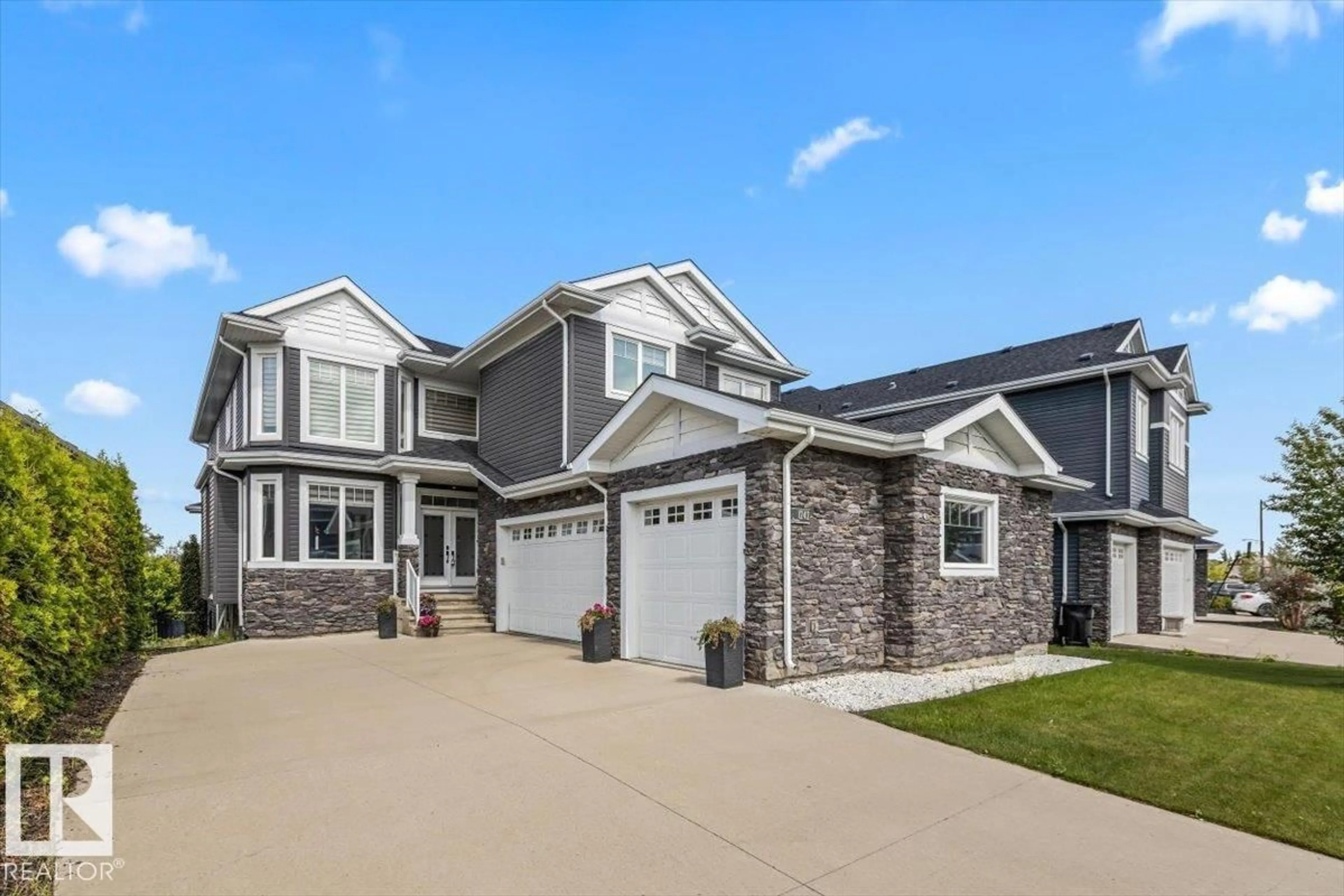 Home with vinyl exterior material, street for 1242 STARLING DR, Edmonton Alberta T5S0K4