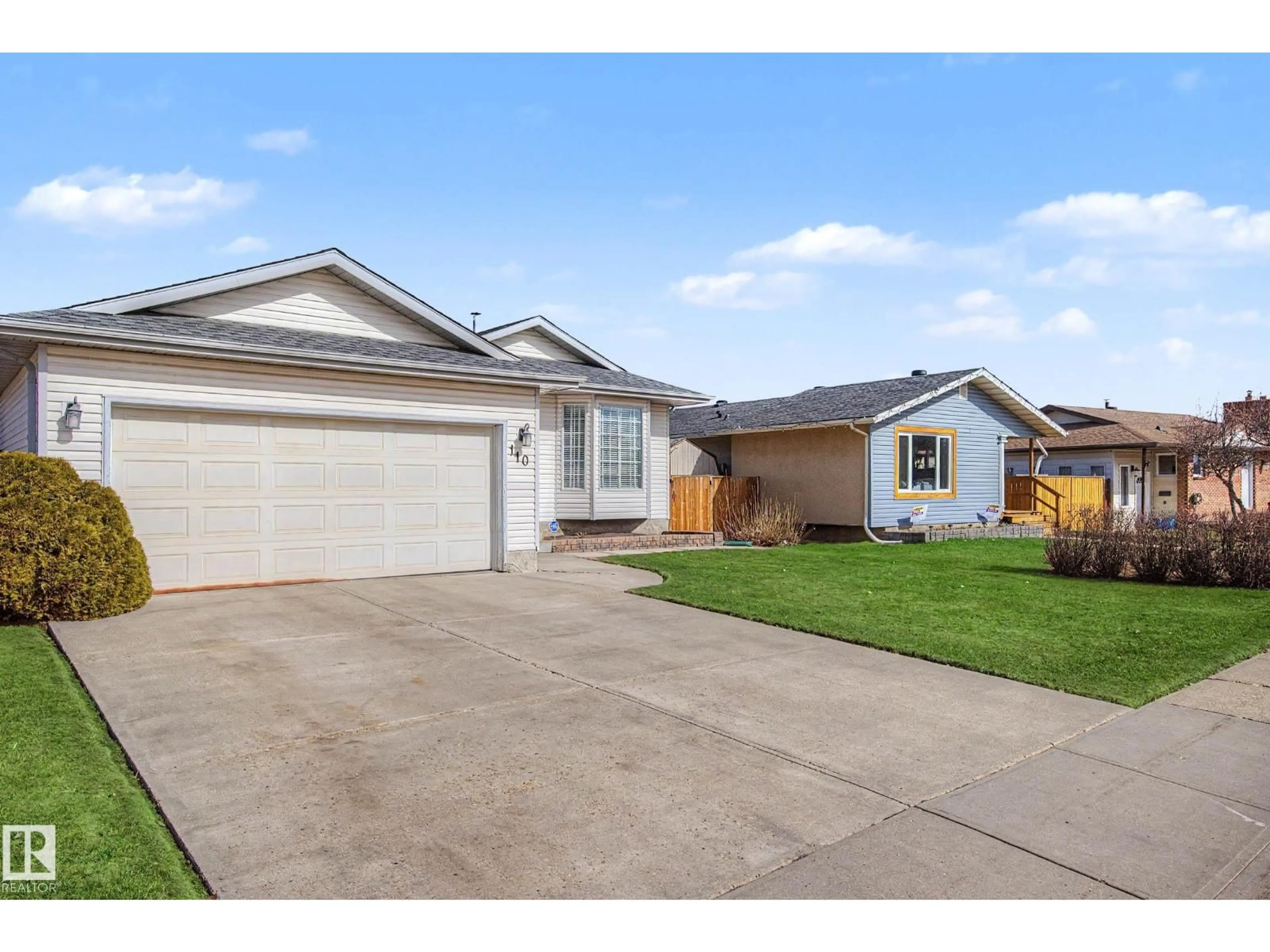 Home with vinyl exterior material, street for 110 LUNNON DR, Gibbons Alberta T0A1N0