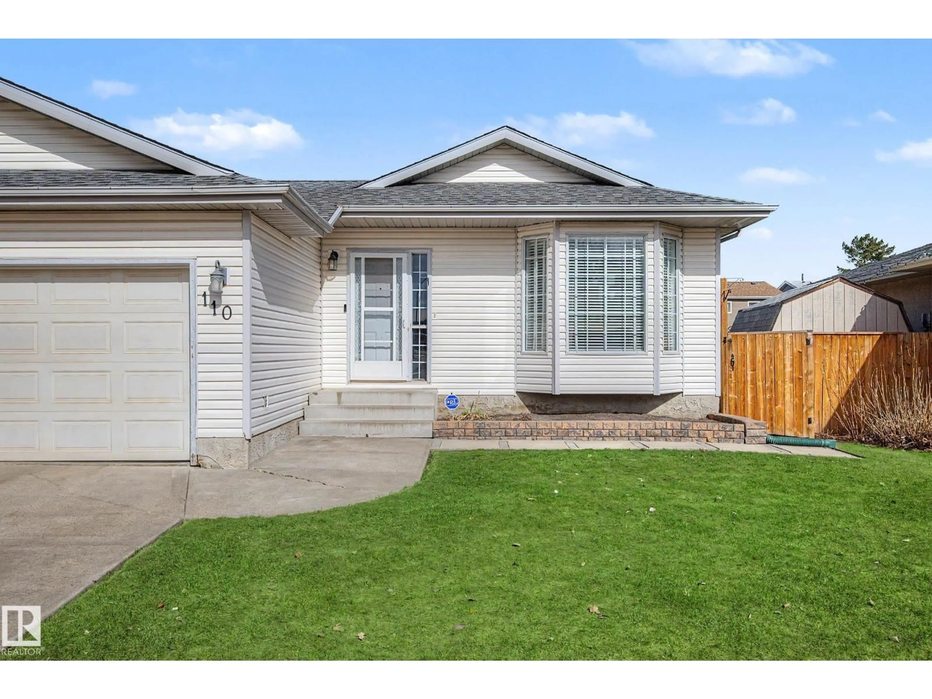 Home with vinyl exterior material, street for 110 LUNNON DR, Gibbons Alberta T0A1N0