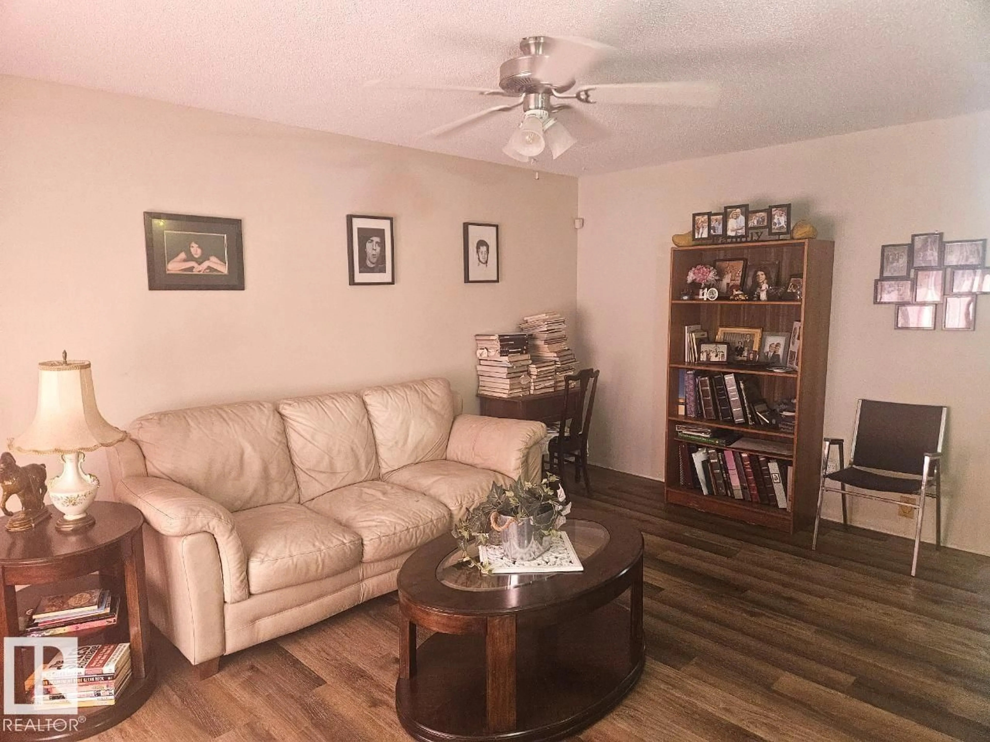 Living room with furniture, wood/laminate floor for 5306 18A AV, Edmonton Alberta T6L1J8