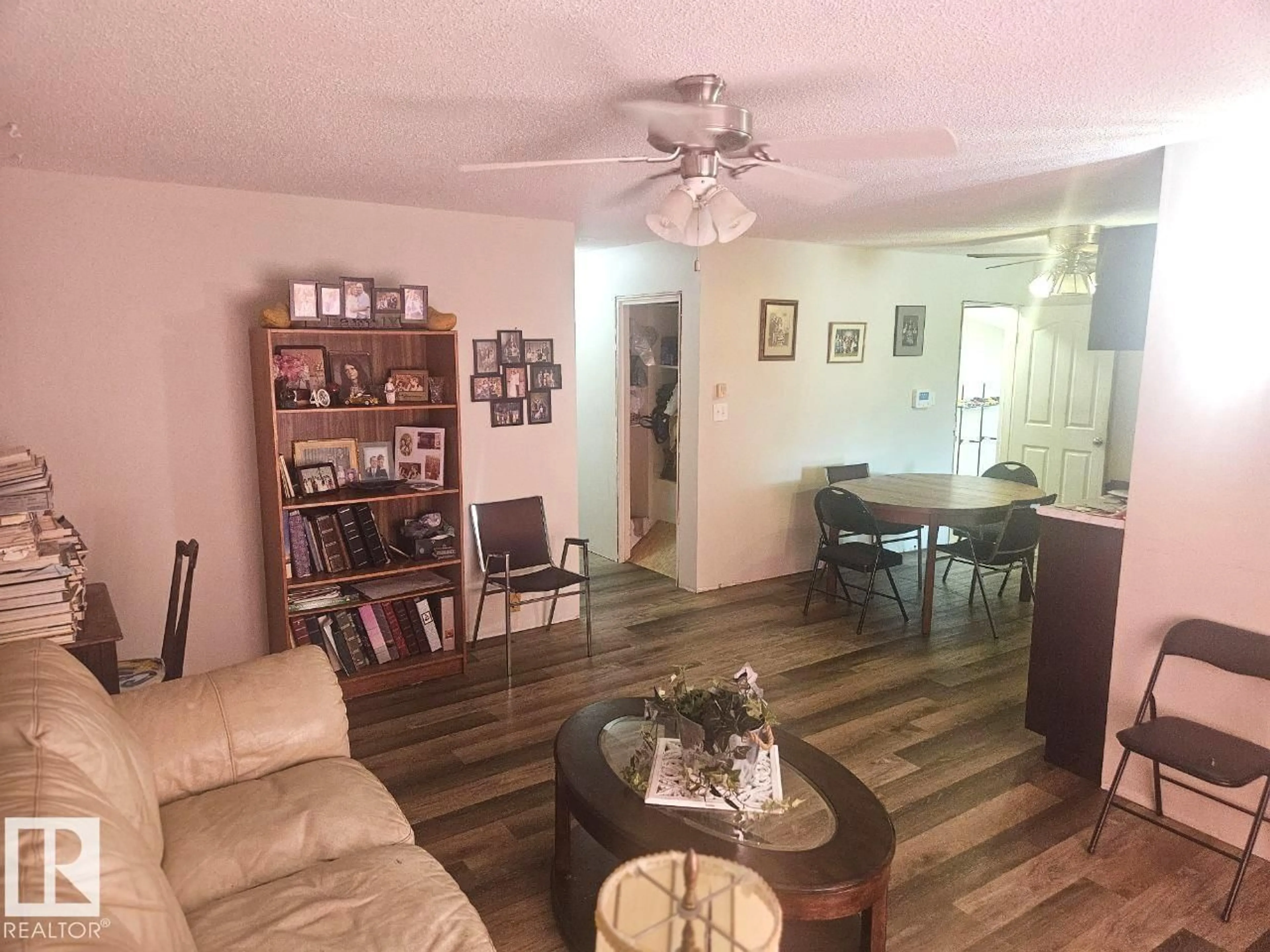 Living room with furniture, wood/laminate floor for 5306 18A AV, Edmonton Alberta T6L1J8