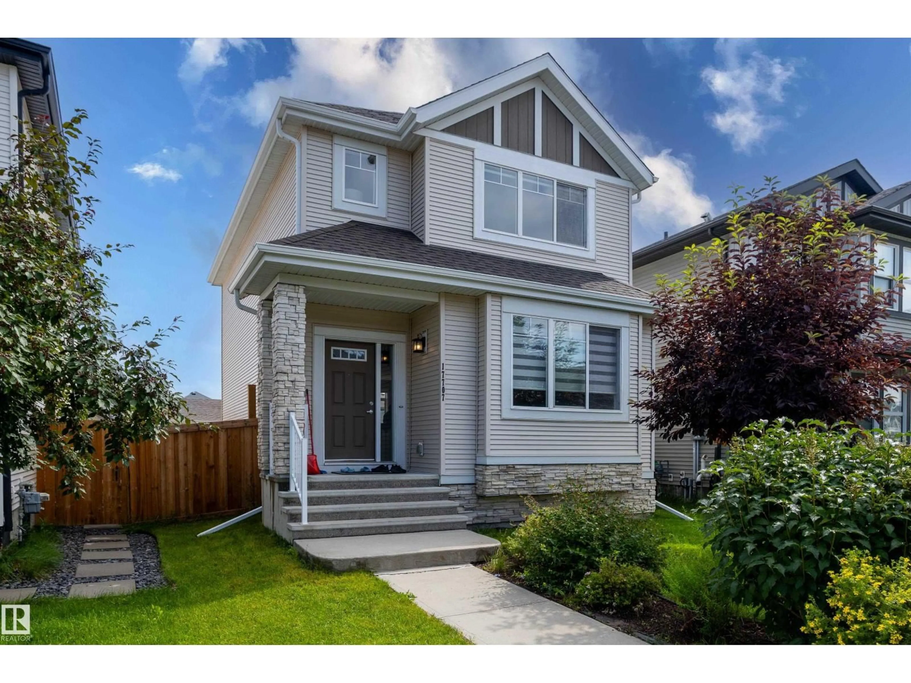Home with vinyl exterior material, street for 17707 59 ST, Edmonton Alberta T5Y0W8