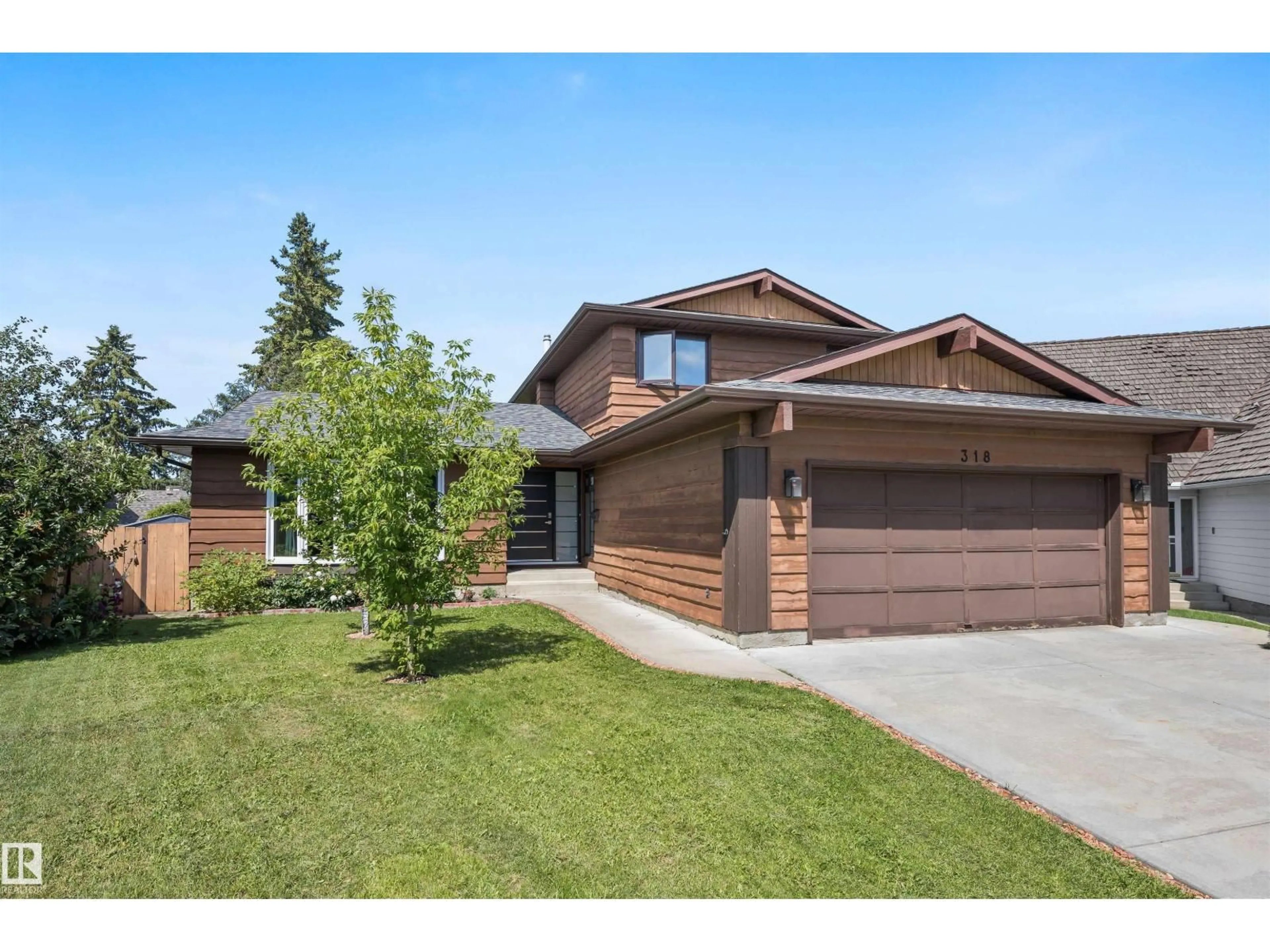Home with brick exterior material, street for 318 GRAND MEADOW CR, Edmonton Alberta T6L1X2