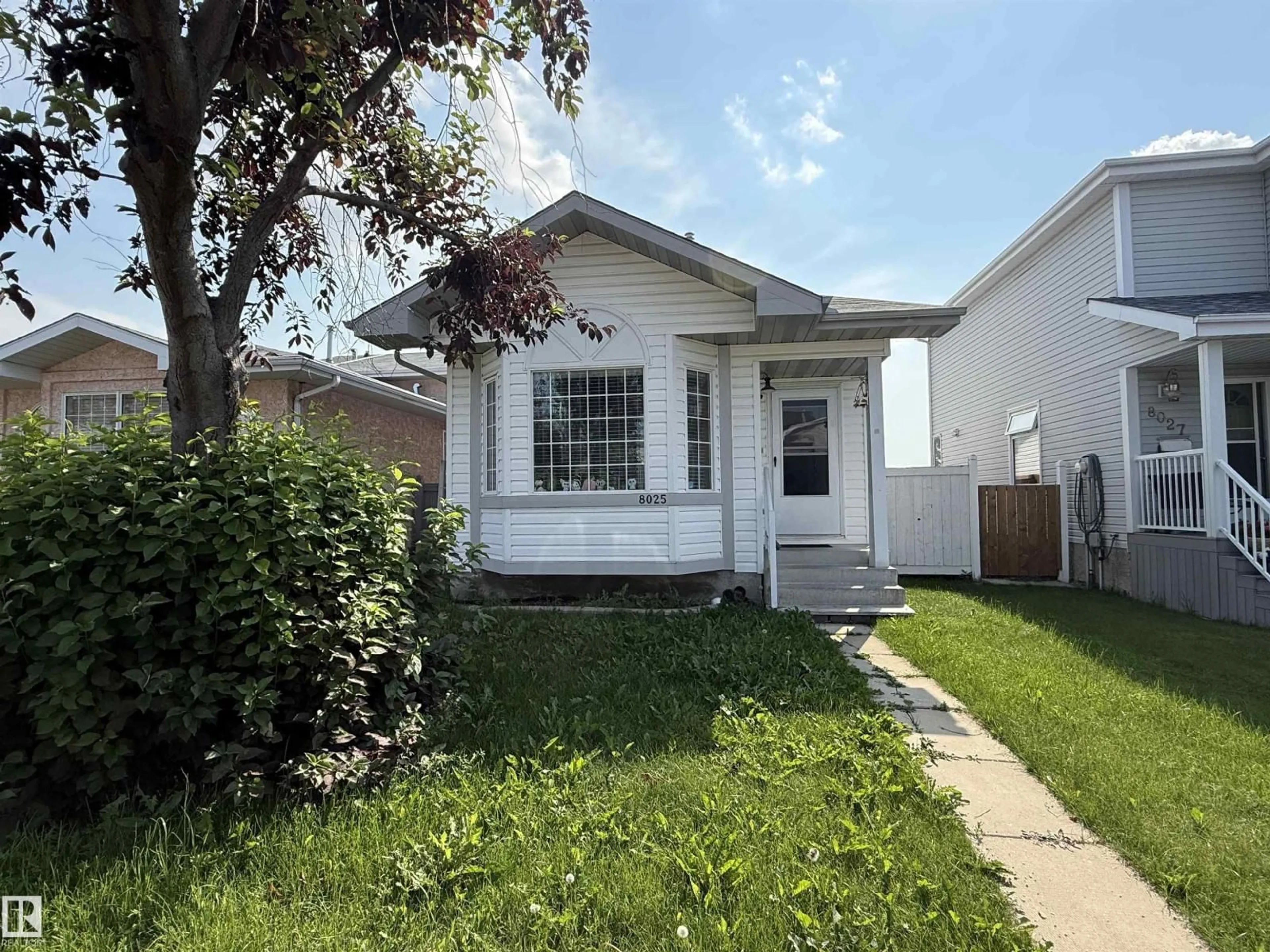 Home with vinyl exterior material, street for 8025 15A AV, Edmonton Alberta T6K4E2