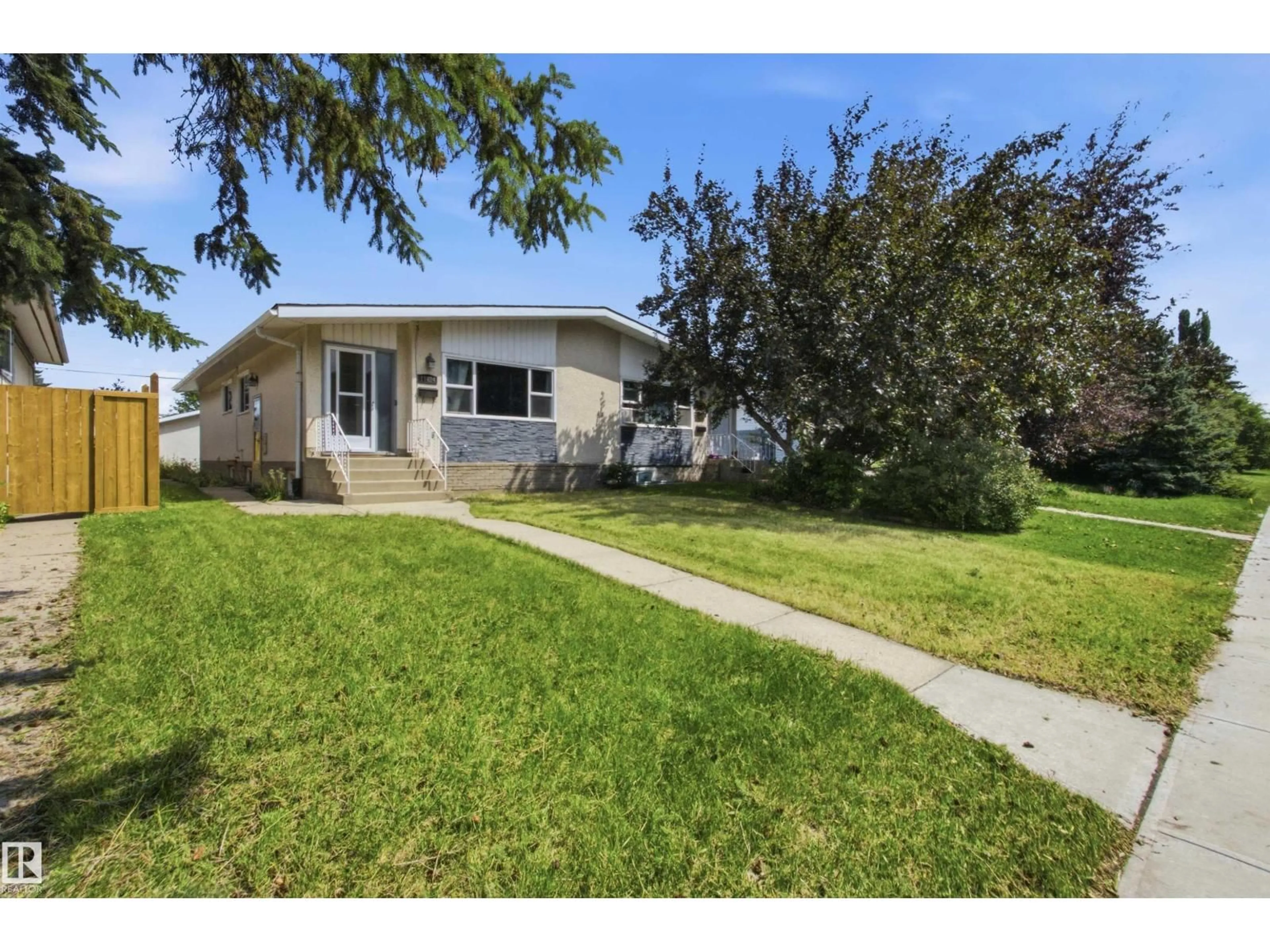 Home with vinyl exterior material, street for NW - 11424 41 AV, Edmonton Alberta T6J0T8