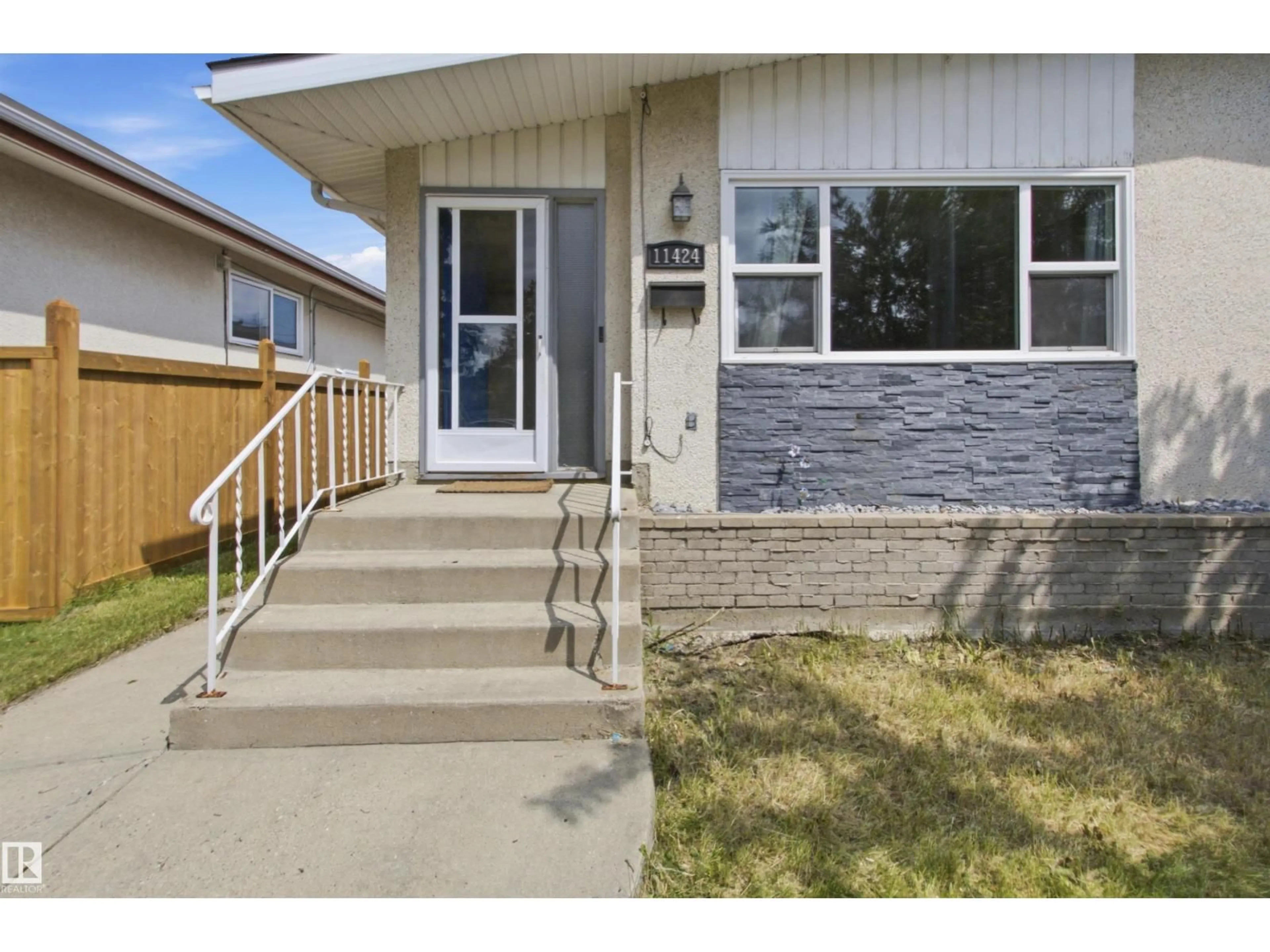 Home with vinyl exterior material, street for NW - 11424 41 AV, Edmonton Alberta T6J0T8