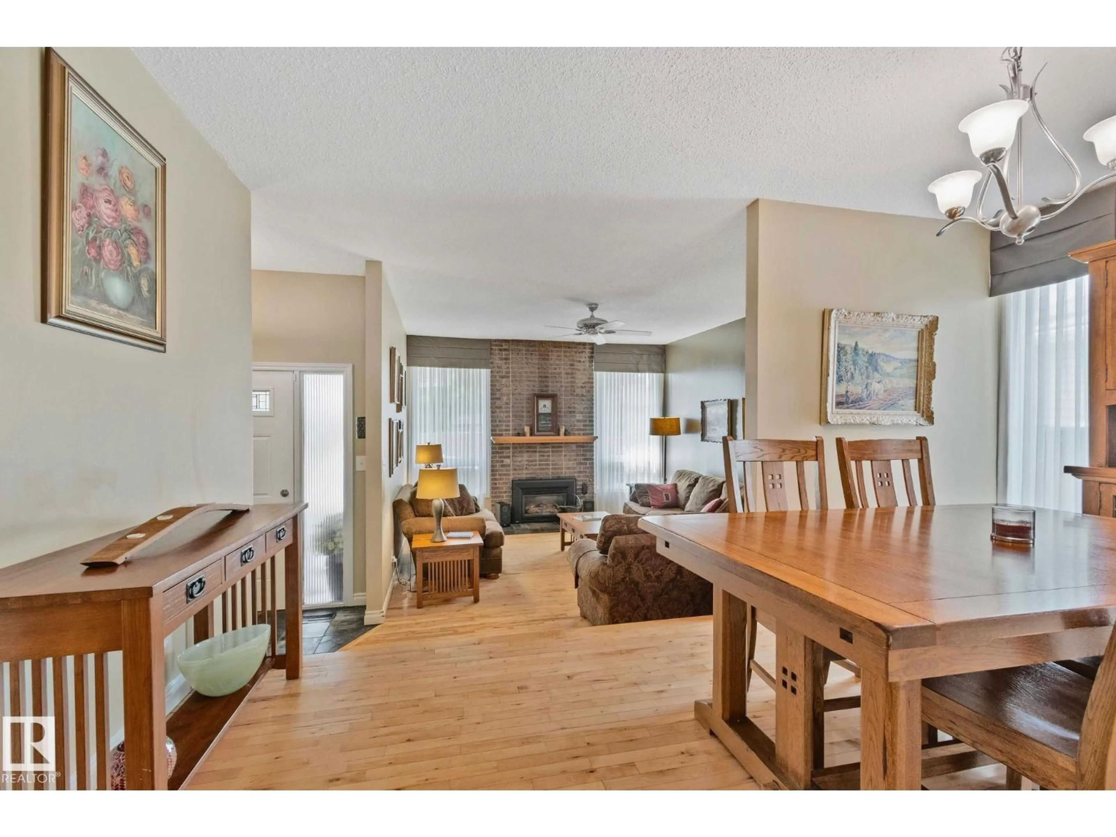 Living room with furniture, wood/laminate floor for NW - 7306 21 AV, Edmonton Alberta T6K2C4