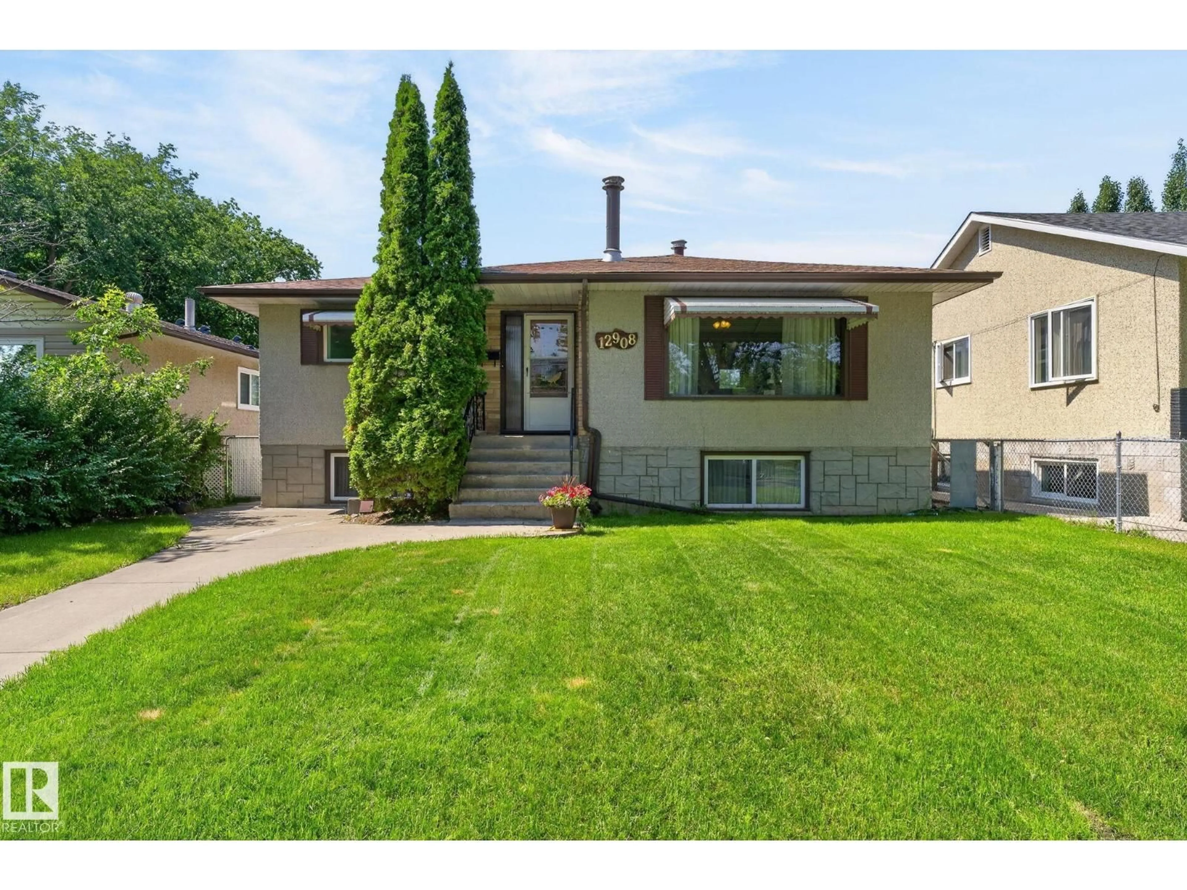 Home with vinyl exterior material, street for 12908 104 ST, Edmonton Alberta T5E4N9