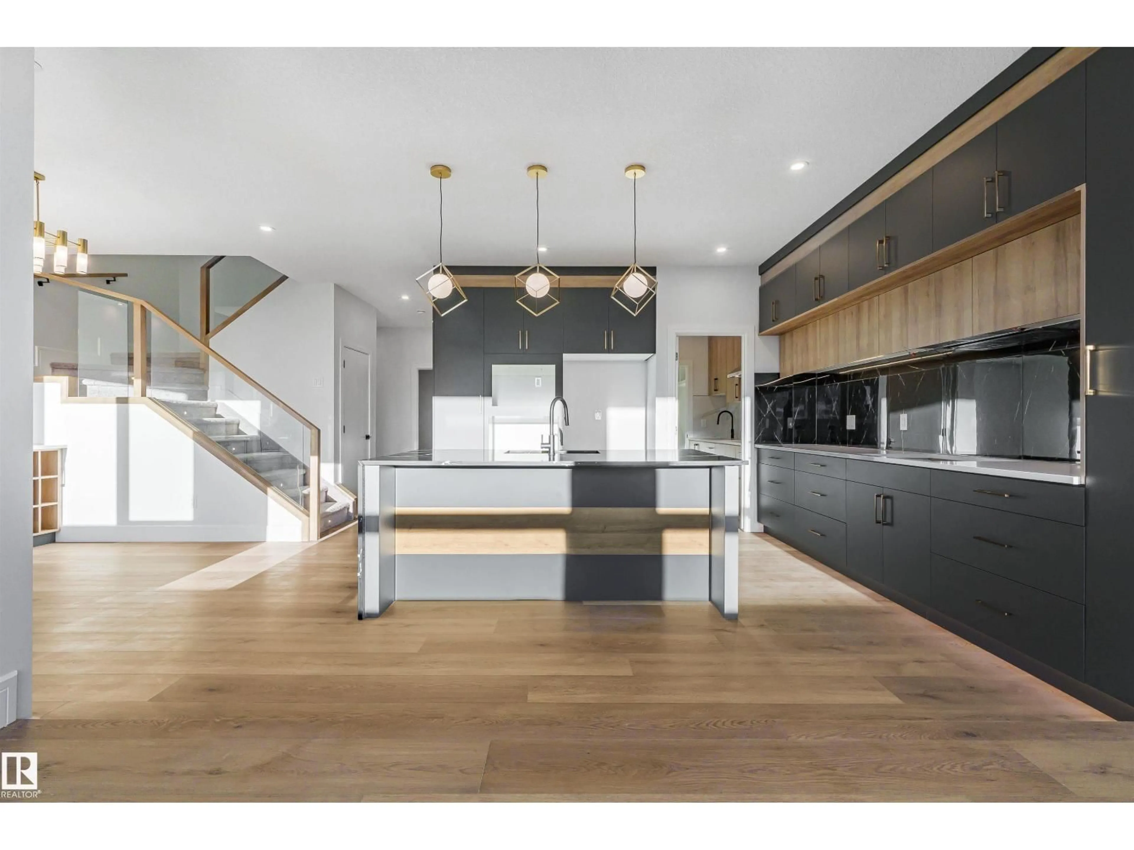 Open concept kitchen, wood/laminate floor for NW - 2808 191 ST, Edmonton Alberta T6M3C3