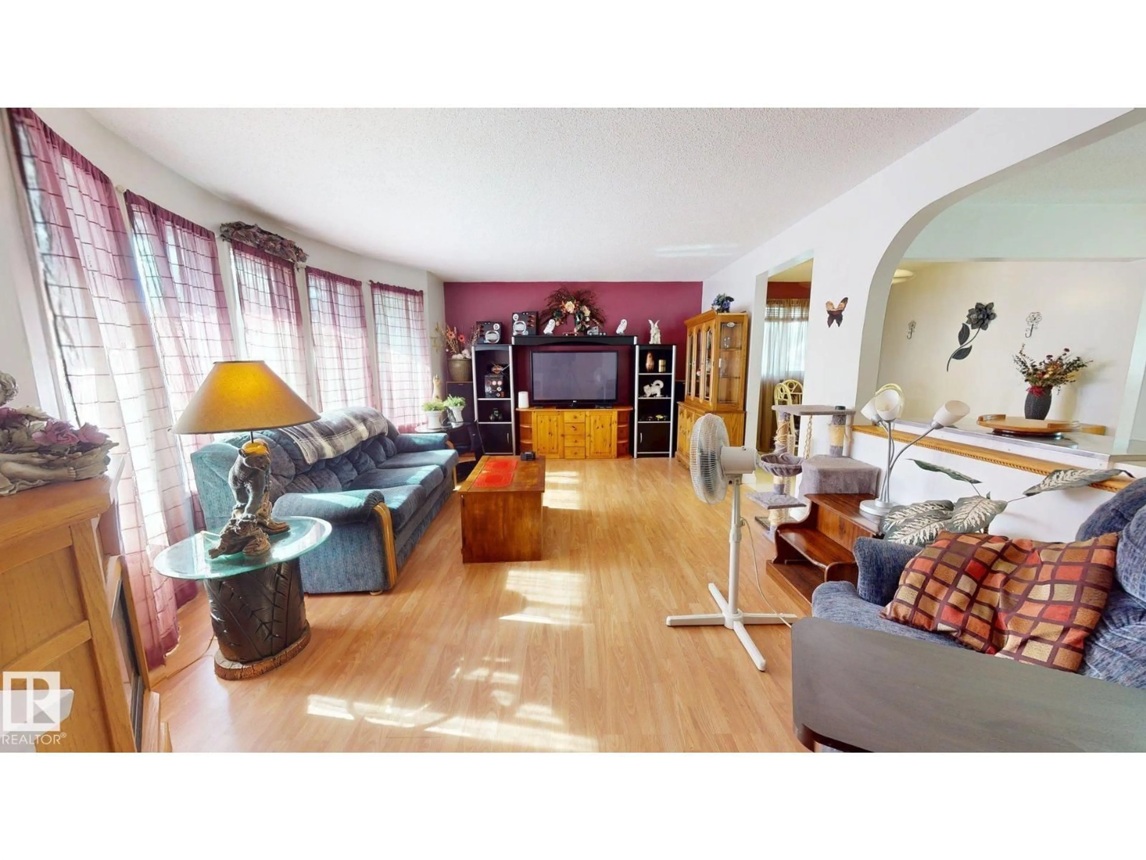 Living room with furniture, wood/laminate floor for 43 HURON DR, Leduc Alberta T9E4N6