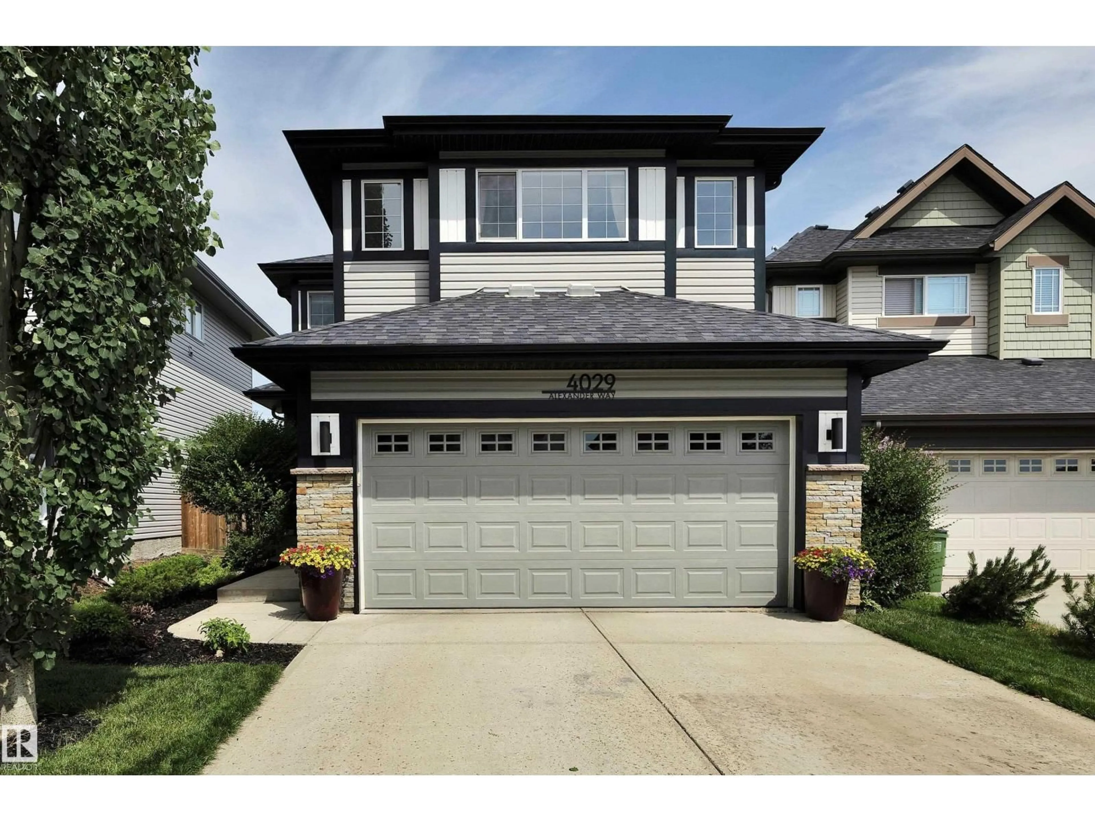 Home with vinyl exterior material, street for 4029 ALEXANDER WY, Edmonton Alberta T6W2C5