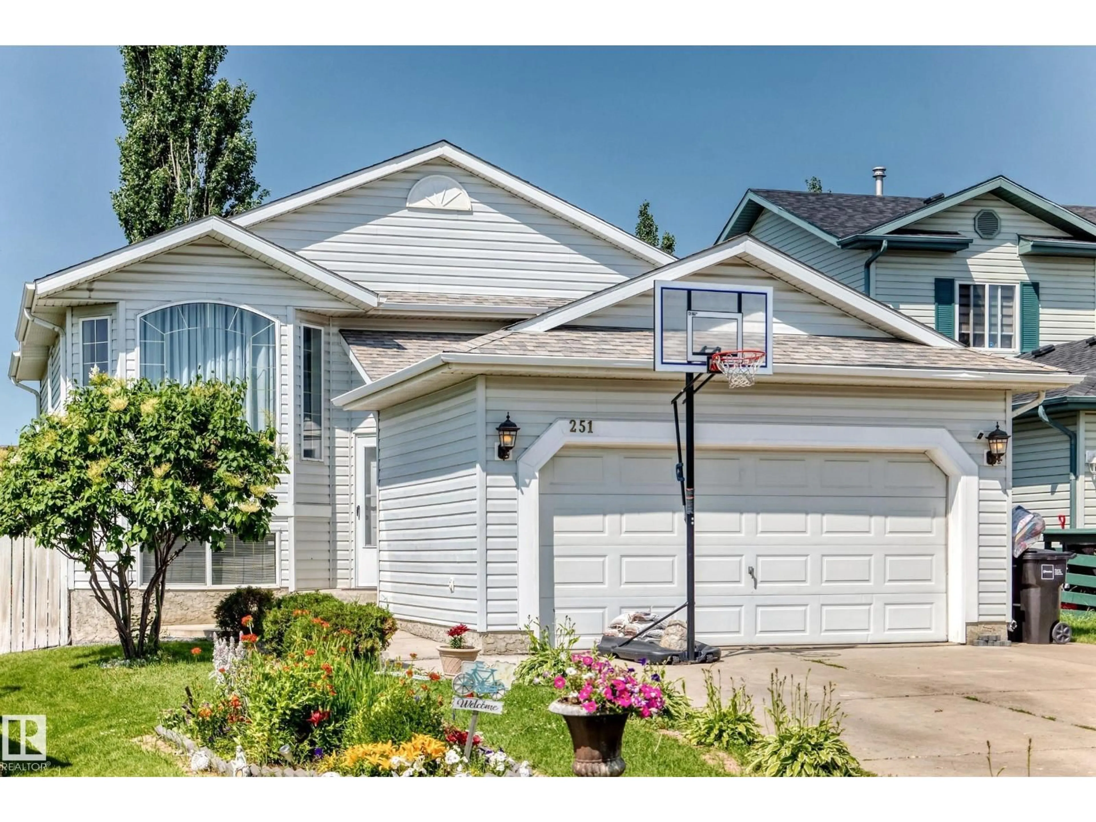 Home with vinyl exterior material, street for 251 DUNVEGAN RD, Edmonton Alberta T5T5E5