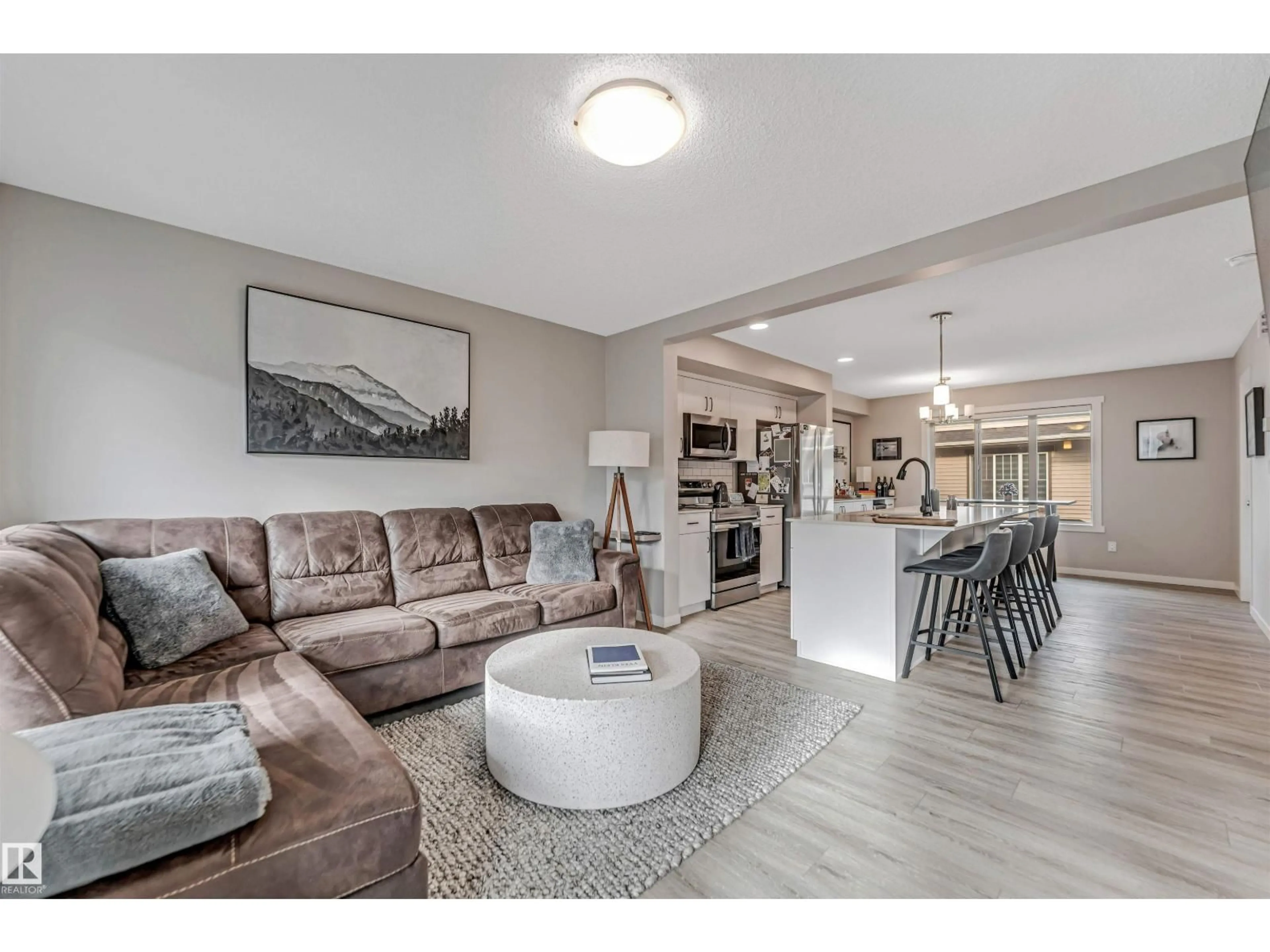 Living room with furniture, unknown for 1530 - 110 TAMARACK BV, Edmonton Alberta T6T2E6