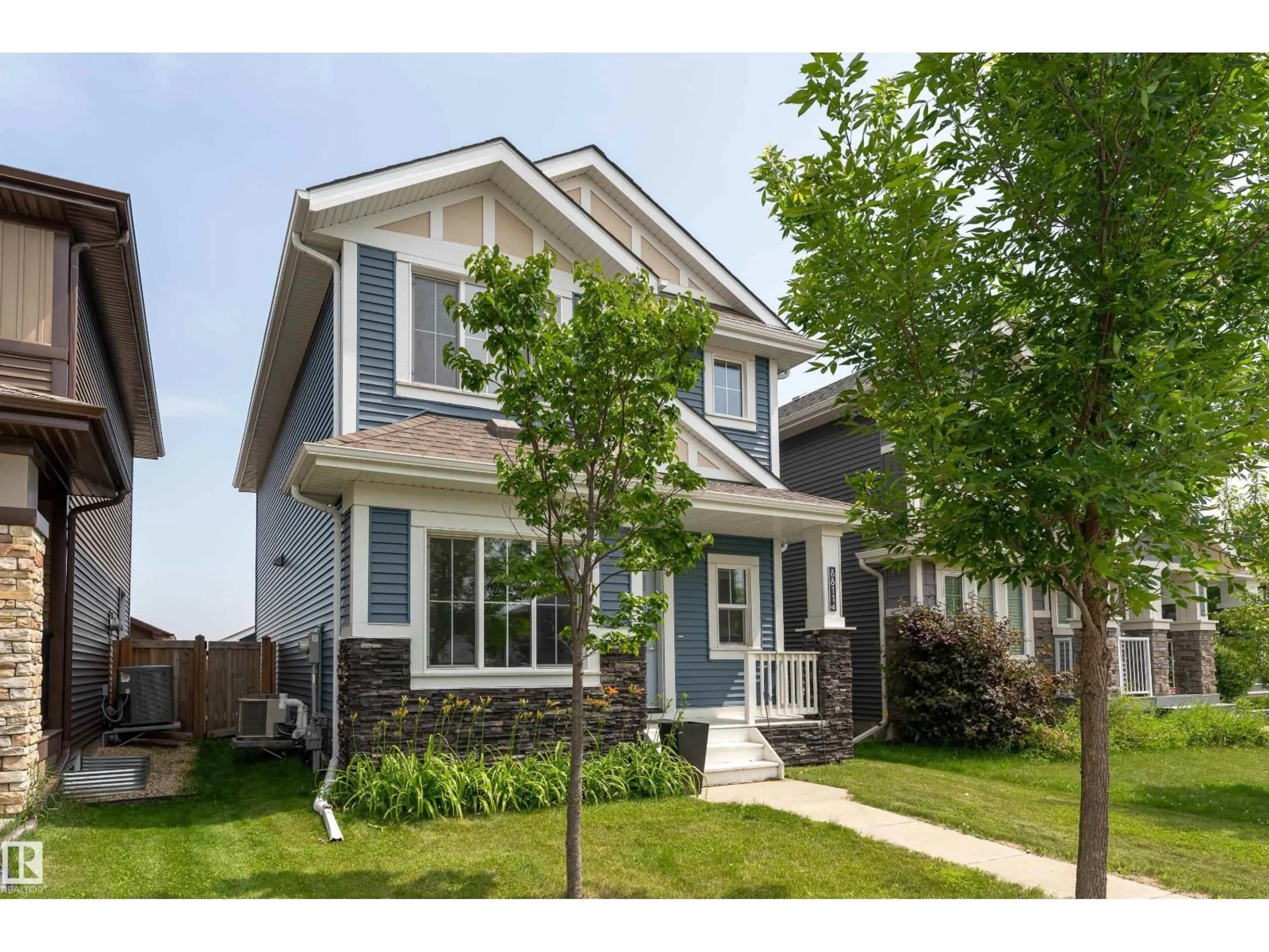 Home with vinyl exterior material, street for NW - 8811 223 ST, Edmonton Alberta T5T7H2