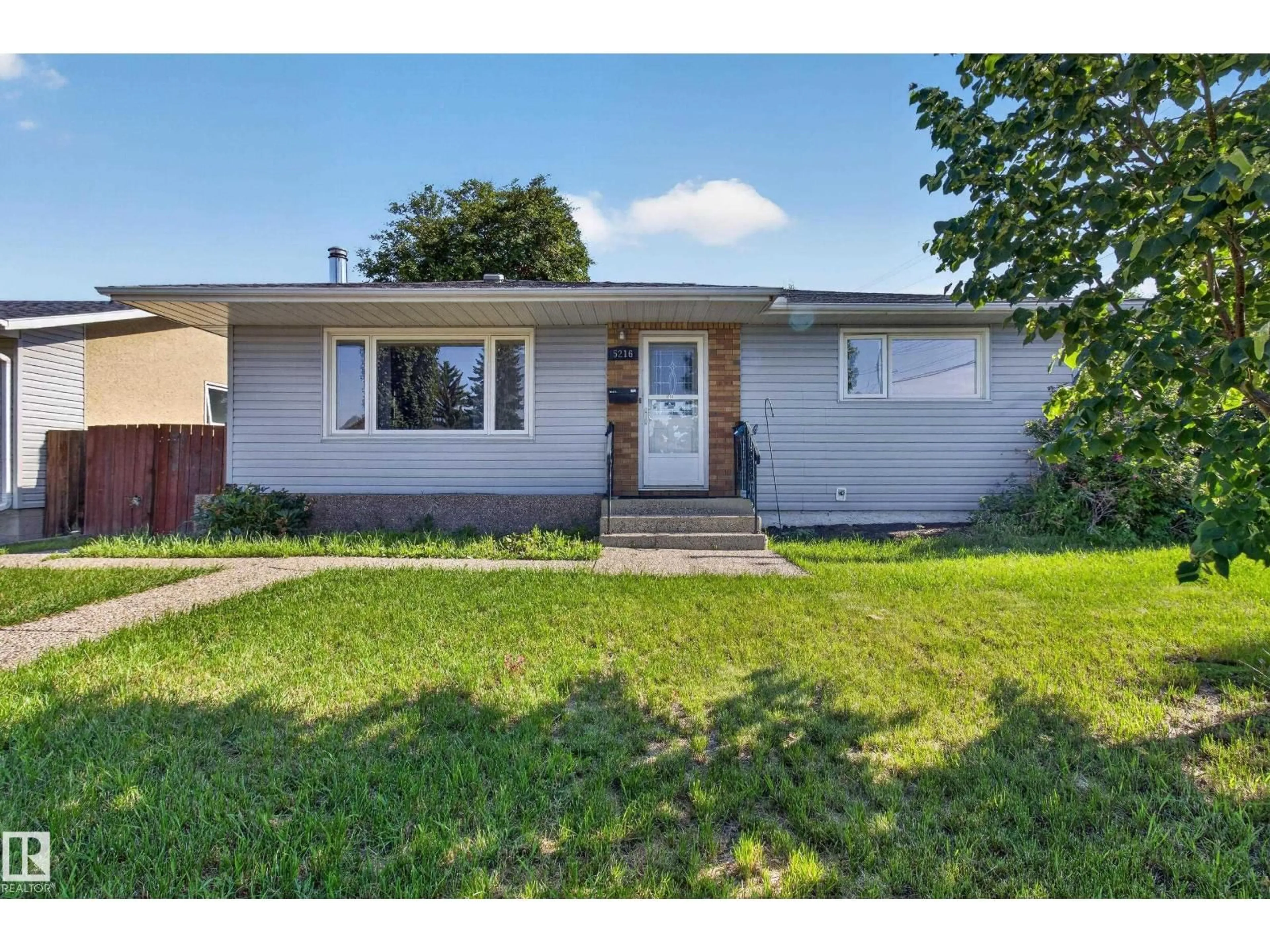 Home with vinyl exterior material, street for NW - 5216 89 AV, Edmonton Alberta T6B0M5