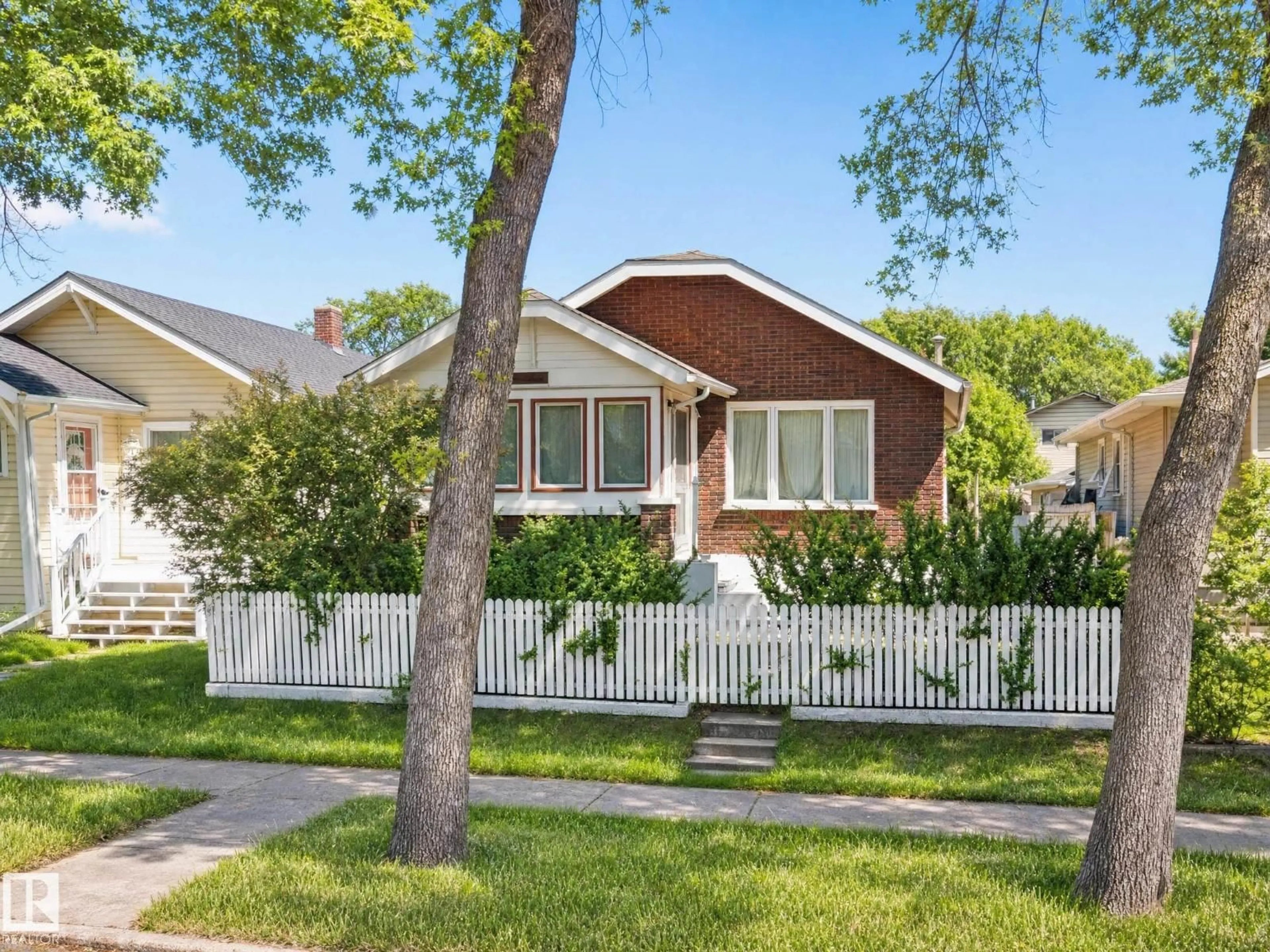 Home with vinyl exterior material, street for NW - 11405 97 ST, Edmonton Alberta T5G1X6